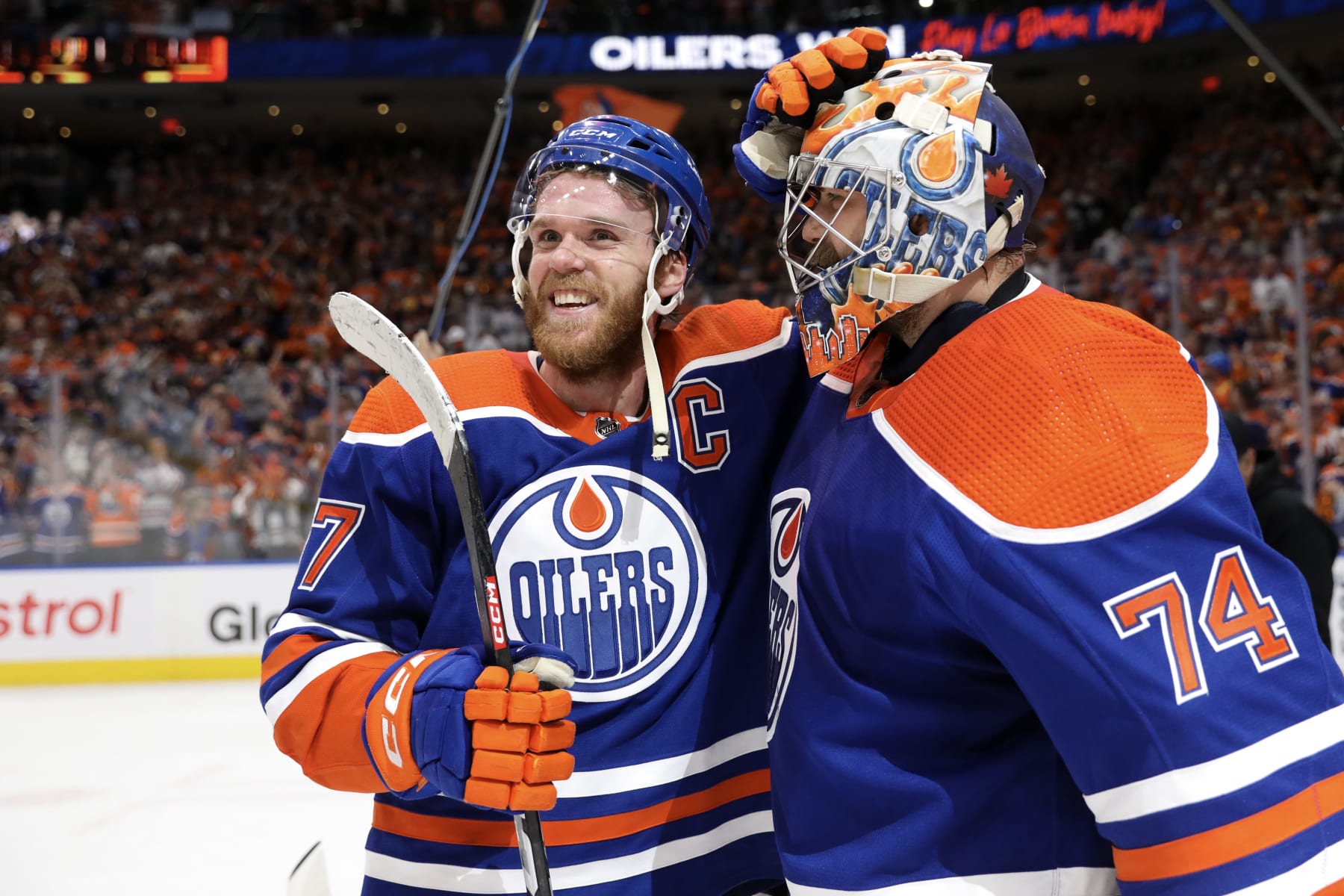 EDMONTON, CANADA - JUNE 02: Connor McDavid #97 and Stuart Skinner #74 of the Edmonton Oilers celebrate after beating the Dallas Stars 2-1 in Game Six of the Western Conference Final of the 2024 Stanley Cup Playoffs at Rogers Place on June 02, 2024 in Edmonton, Alberta, Canada. (Photo by Codie McLachlan/Getty Images)