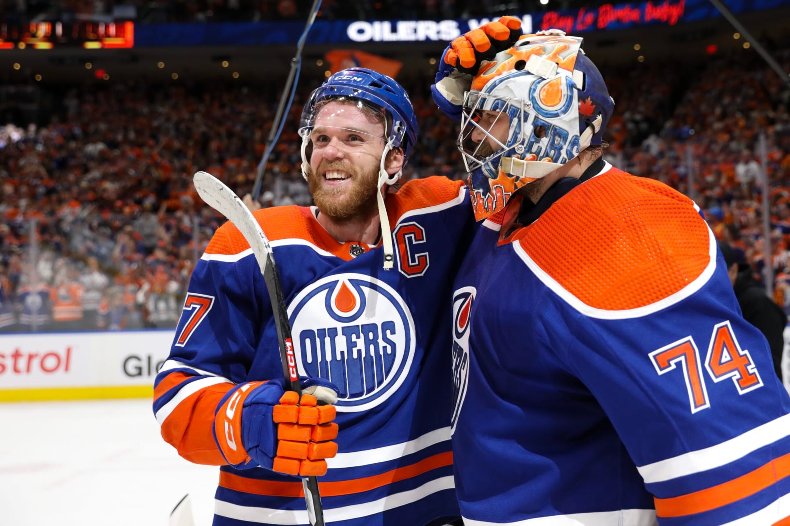 EDMONTON, CANADA - JUNE 02: Connor McDavid #97 and Stuart Skinner #74 of the Edmonton Oilers celebrate after beating the Dallas Stars 2-1 in Game Six of the Western Conference Final of the 2024 Stanley Cup Playoffs at Rogers Place on June 02, 2024 in Edmonton, Alberta, Canada. (Photo by Codie McLachlan/Getty Images)