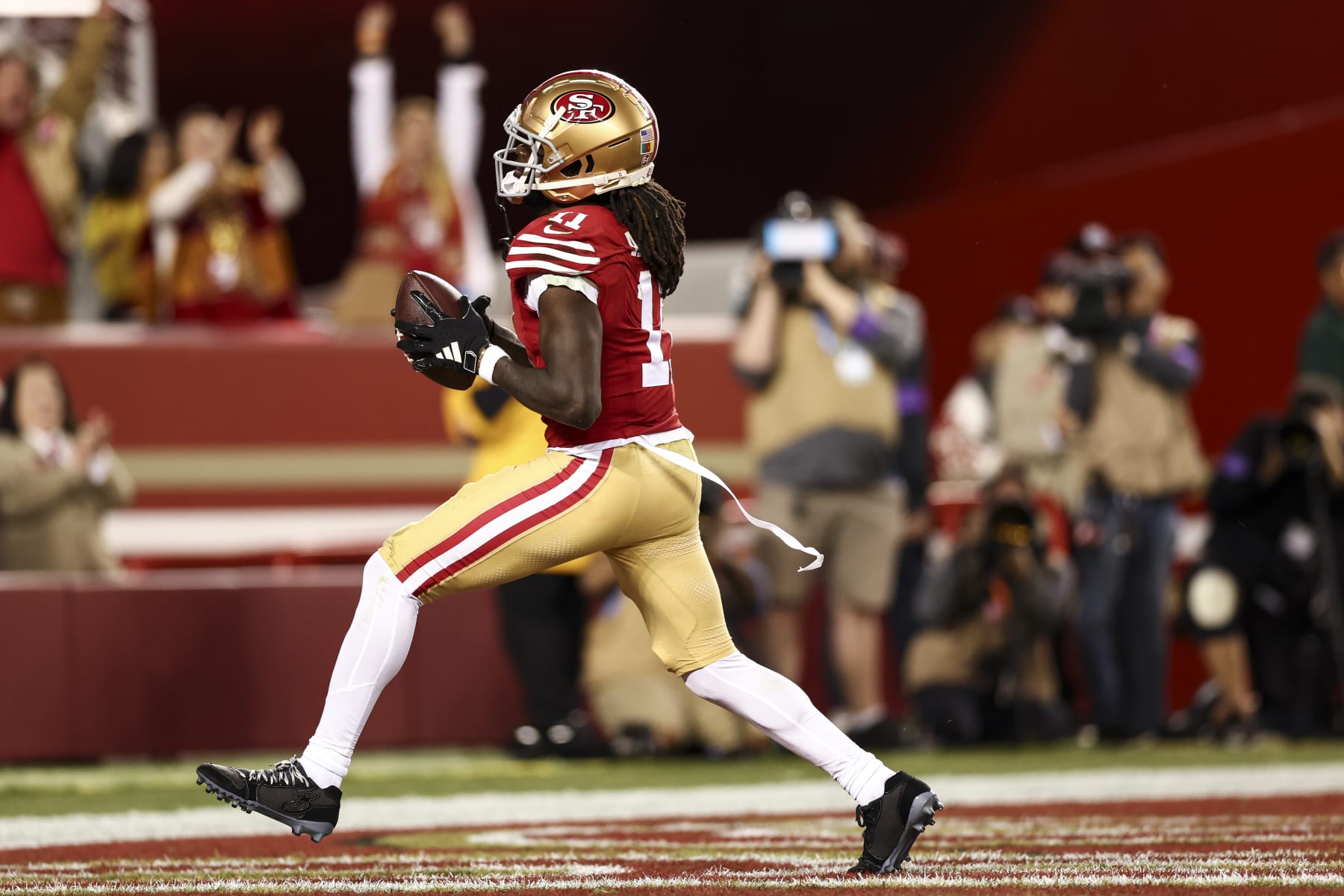 SANTA CLARA, CA - JANUARY 28: Brandon Aiyuk #11 of the San Francisco 49ers celebrates after a diving catch during the NFC Championship NFL football game against the Detroit Lions at Levi's Stadium on January 28, 2024 in Santa Clara, California. (Photo by Kevin Sabitus/Getty Images)