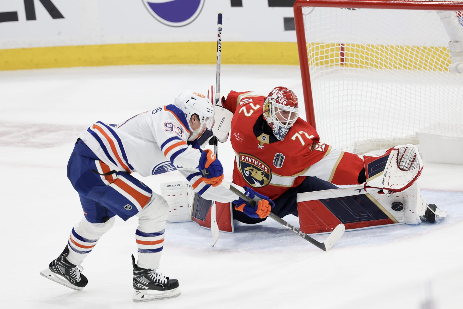 SUNRISE, FLORIDA - JUNE 08: Sergei Bobrovsky #72 of the Florida Panthers makes a save against Ryan Nugent-Hopkins #93 of the Edmonton Oilers during the first period in Game One of the 2024 Stanley Cup Final at Amerant Bank Arena on June 08, 2024 in Sunrise, Florida. (Photo by Elsa/Getty Images)