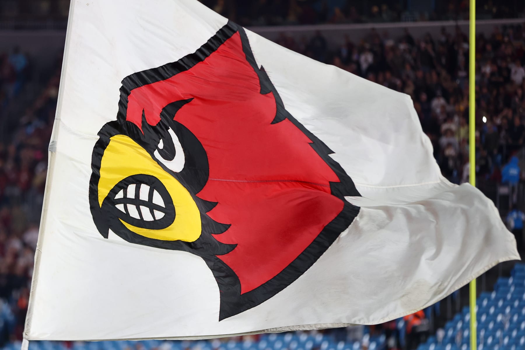 CHARLOTTE, NORTH CAROLINA - DECEMBER 2: The Louisville Cardinals logo is shown on a flag before the Florida State Seminoles take on the Louisville Cardinals during the ACC Championship at Bank of America Stadium on December 2, 2023 in Charlotte, North Carolina. (Photo by Isaiah Vazquez/Getty Images)