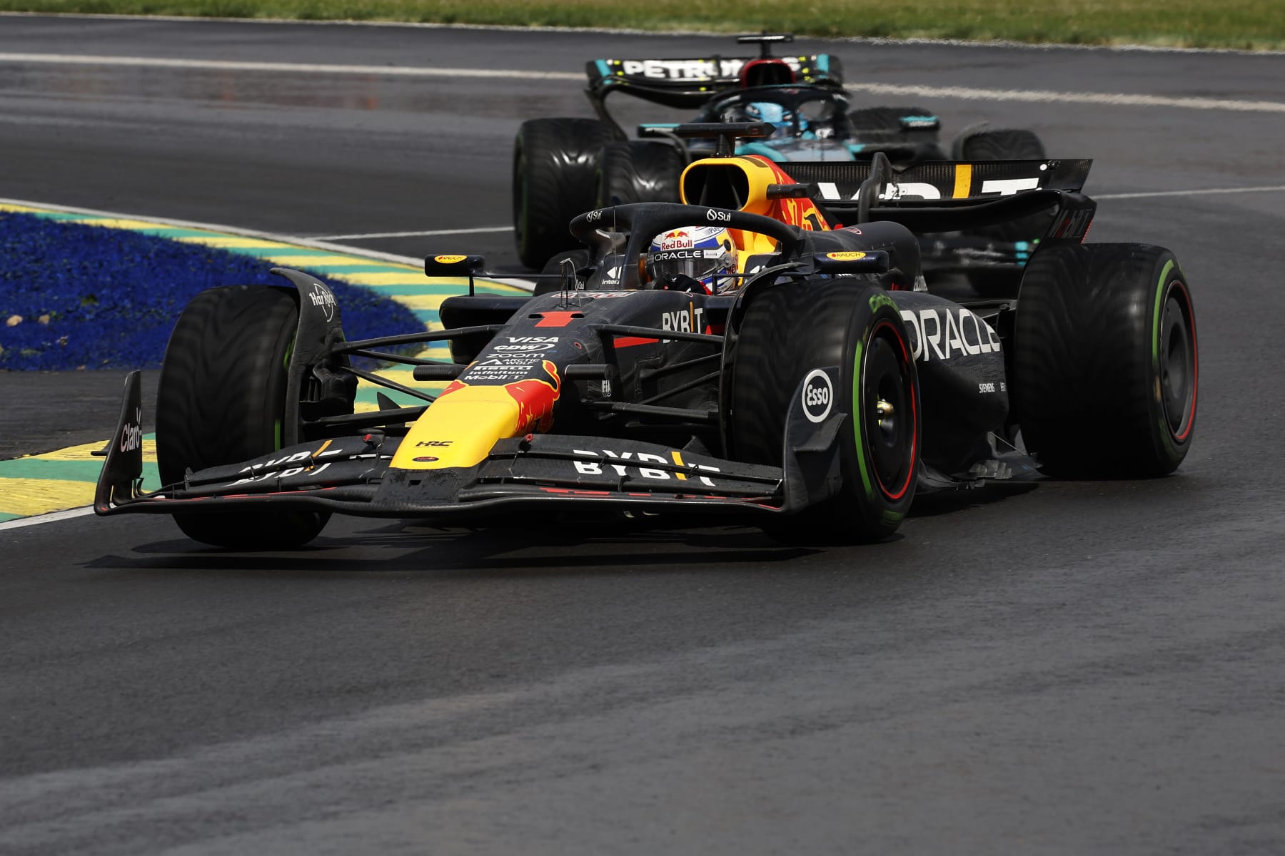 MONTREAL, QUEBEC - JUNE 09: Max Verstappen of the Netherlands driving the (1) Oracle Red Bull Racing RB20 leads George Russell of Great Britain driving the (63) Mercedes AMG Petronas F1 Team W15 on track during the F1 Grand Prix of Canada at Circuit Gilles Villeneuve on June 09, 2024 in Montreal, Quebec. (Photo by Chris Graythen/Getty Images)
