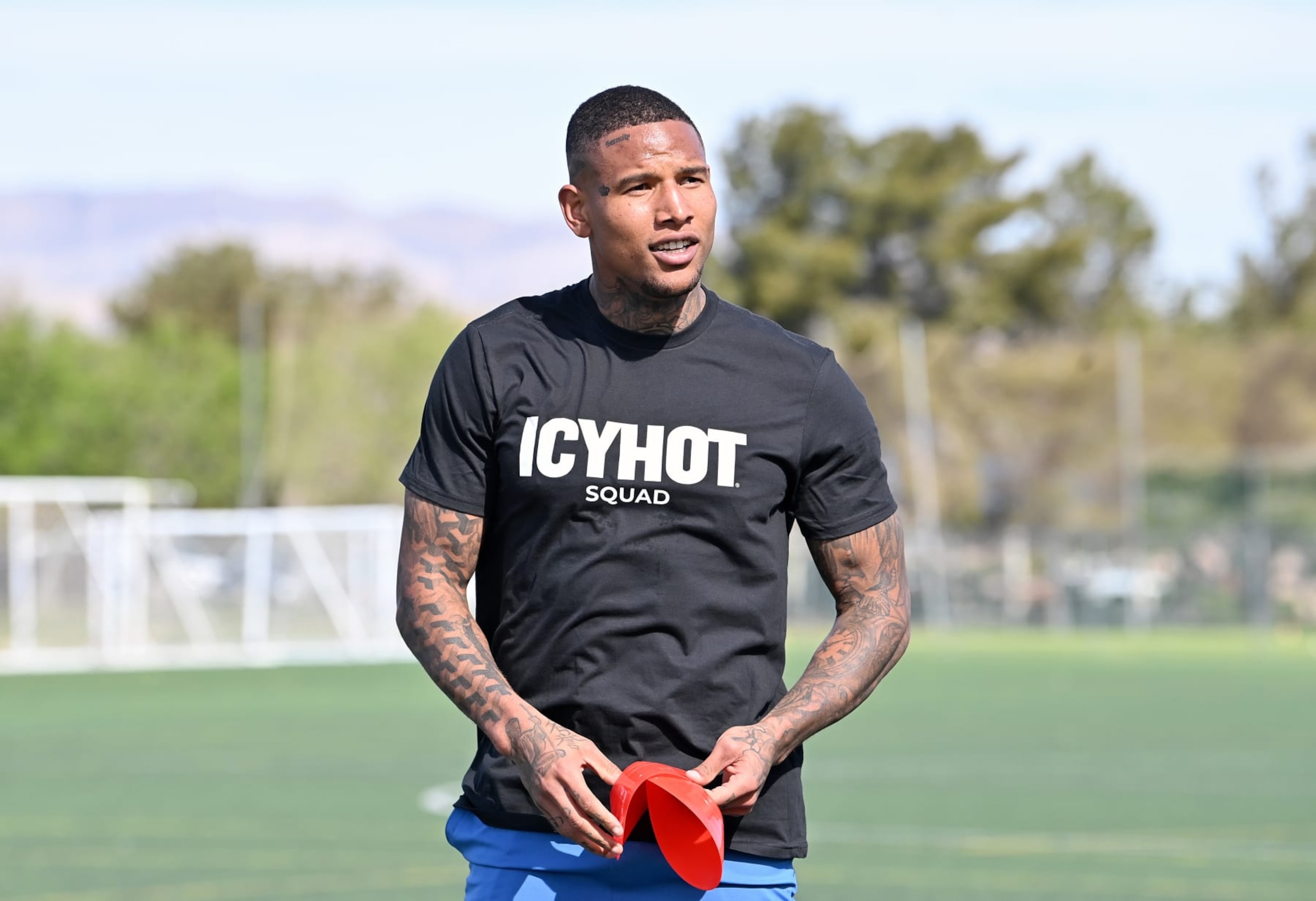 LAS VEGAS, NEVADA - APRIL 04: Icy Hot squad member Darren Waller mentors pro football prospects and Icy Hot squad members Ja'Tavion Sanders and Cade Stover on April 04, 2024 in Las Vegas, Nevada. (Photo by Denise Truscello/Getty Images for Icy Hot)