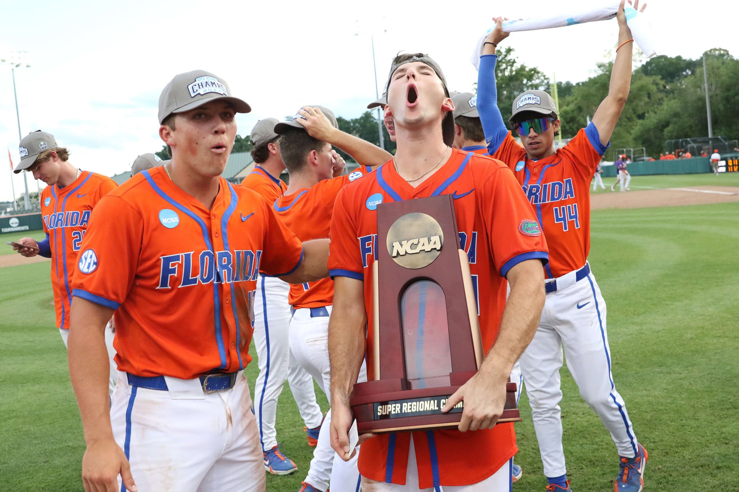 CLEMSON, SC - JUNE 09: Florida Gators out field Michael Robertson (11) hold the Super Regional trophy during the College D1 Baseball Super Regional game between the Florida Gators and the Clemson Tigers on June 9, 2024 at Doug Kingsmore Stadium in Clemson, S.C.  (Photo by John Byrum/Icon Sportswire via Getty Images)