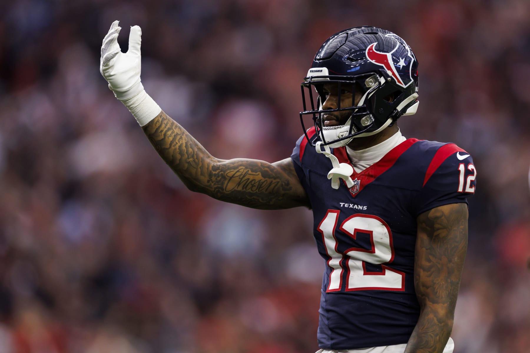 HOUSTON, TEXAS - JANUARY 13: Nico Collins #12 of the Houston Texans celebrates after a catch during an AFC wild-card playoff football game against the Cleveland Browns at NRG Stadium on January 13, 2024 in Houston, Texas. (Photo by Ryan Kang/Getty Images)