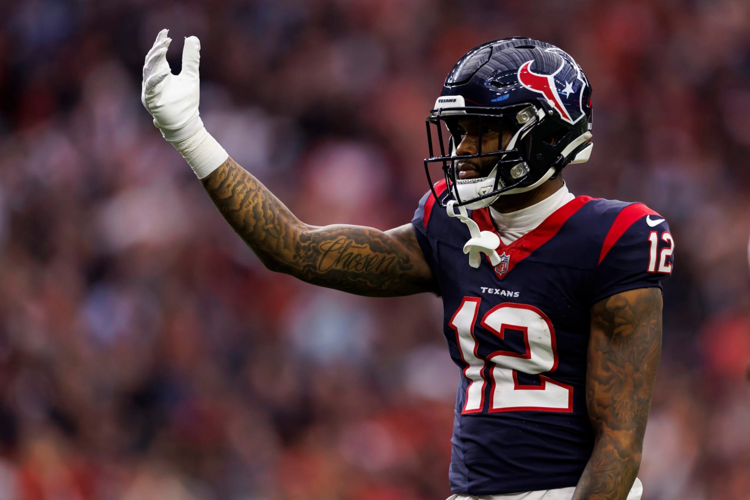HOUSTON, TEXAS - JANUARY 13: Nico Collins #12 of the Houston Texans celebrates after a catch during an AFC wild-card playoff football game against the Cleveland Browns at NRG Stadium on January 13, 2024 in Houston, Texas. (Photo by Ryan Kang/Getty Images)