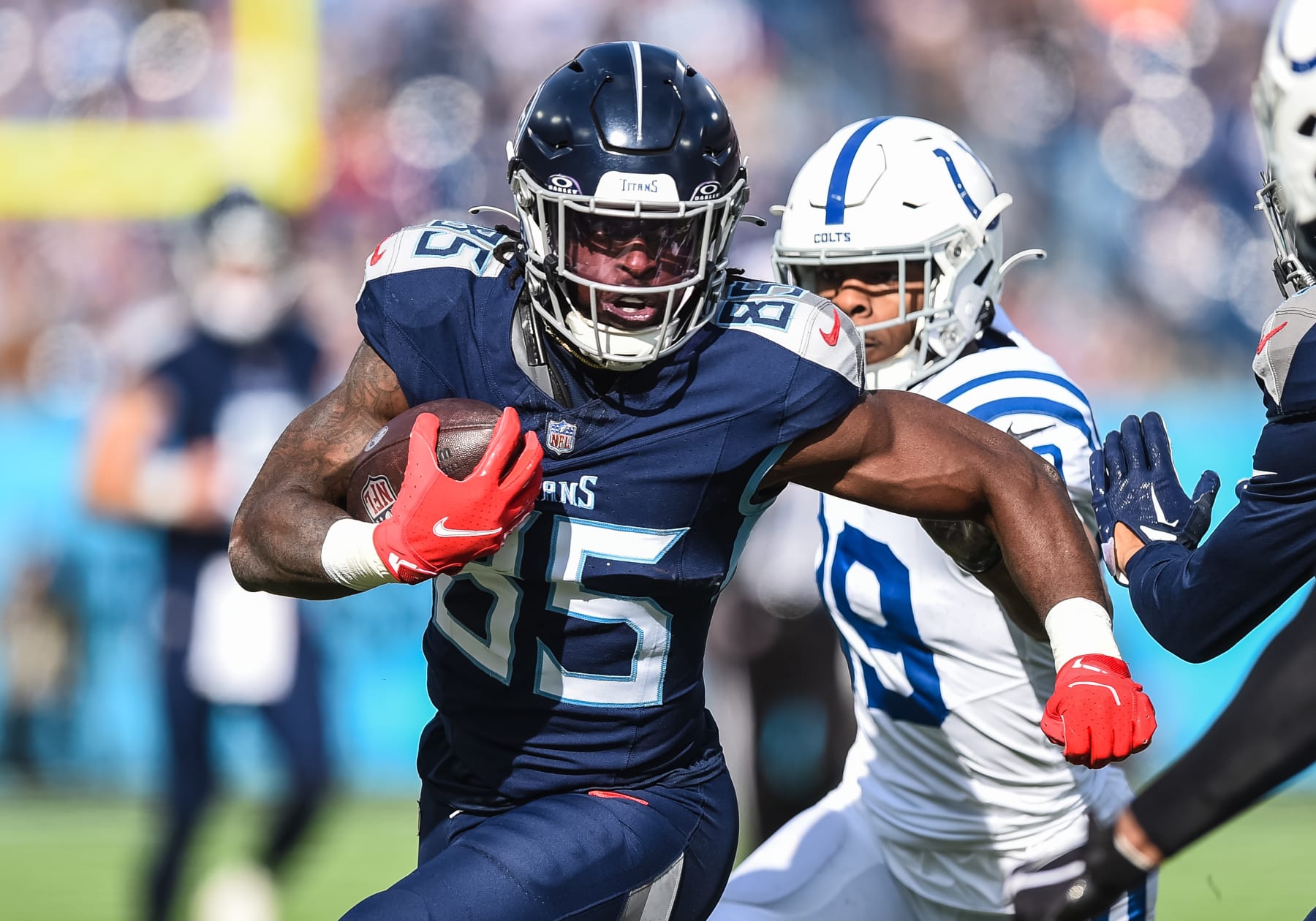 NASHVILLE, TN - DECEMBER 03: Tennessee Titans tight end Chigoziem Okonkwo (85) runs with the ball during the NFL game between the Tennessee Titans and the Indianapolis Colts on December 3, 2023, at Nissan Stadium in Nashville, TN. (Photo by Bryan Lynn/Icon Sportswire via Getty Images)