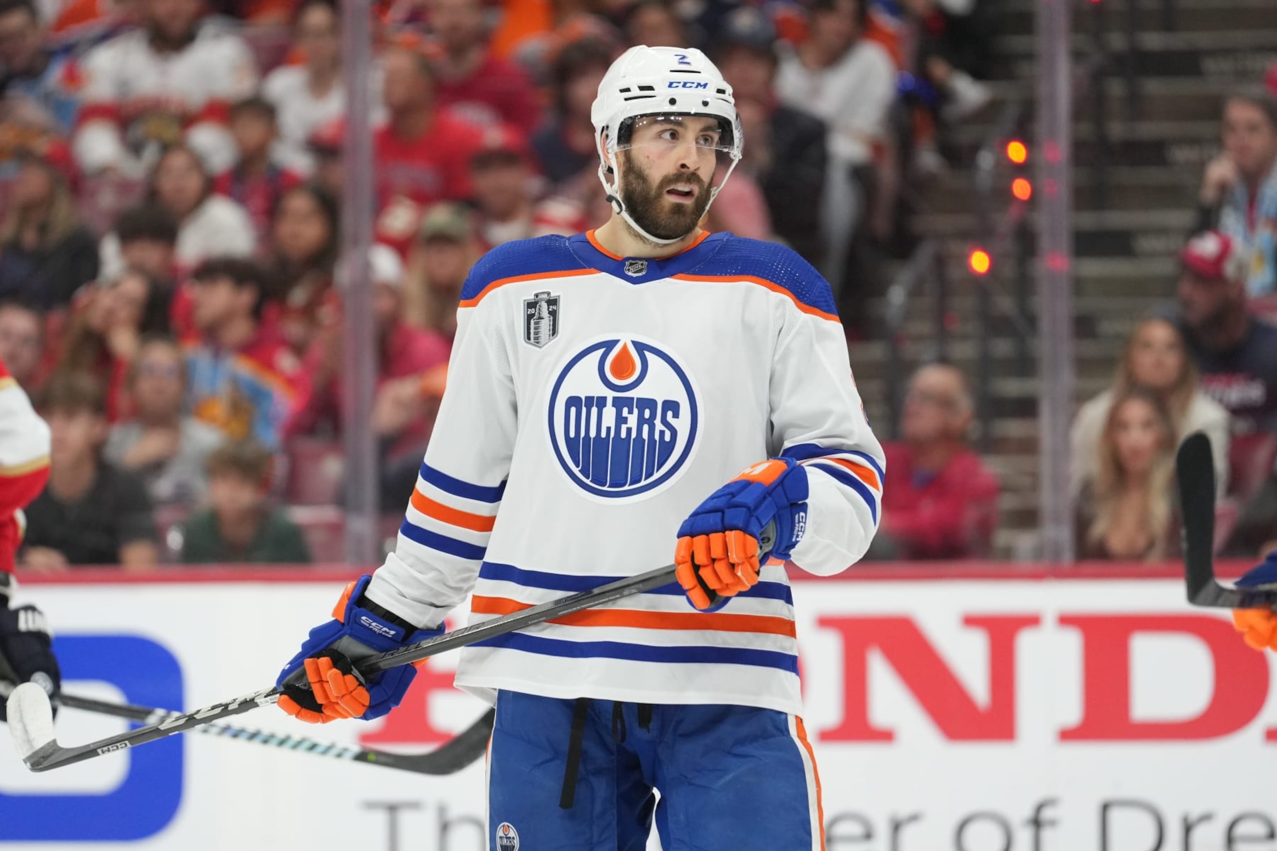 SUNRISE, FL - JUNE 08: Edmonton Oilers defenseman Evan Bouchard (2) eyes a teammate in the second period during game one of the Stanley Cup Finals between the Edmonton Oilers and the Florida Panthers on Saturday, June 8, 2024 at Amerant Bank Area in Sunrise, Fla. (Photo by Peter Joneleit/Icon Sportswire via Getty Images)