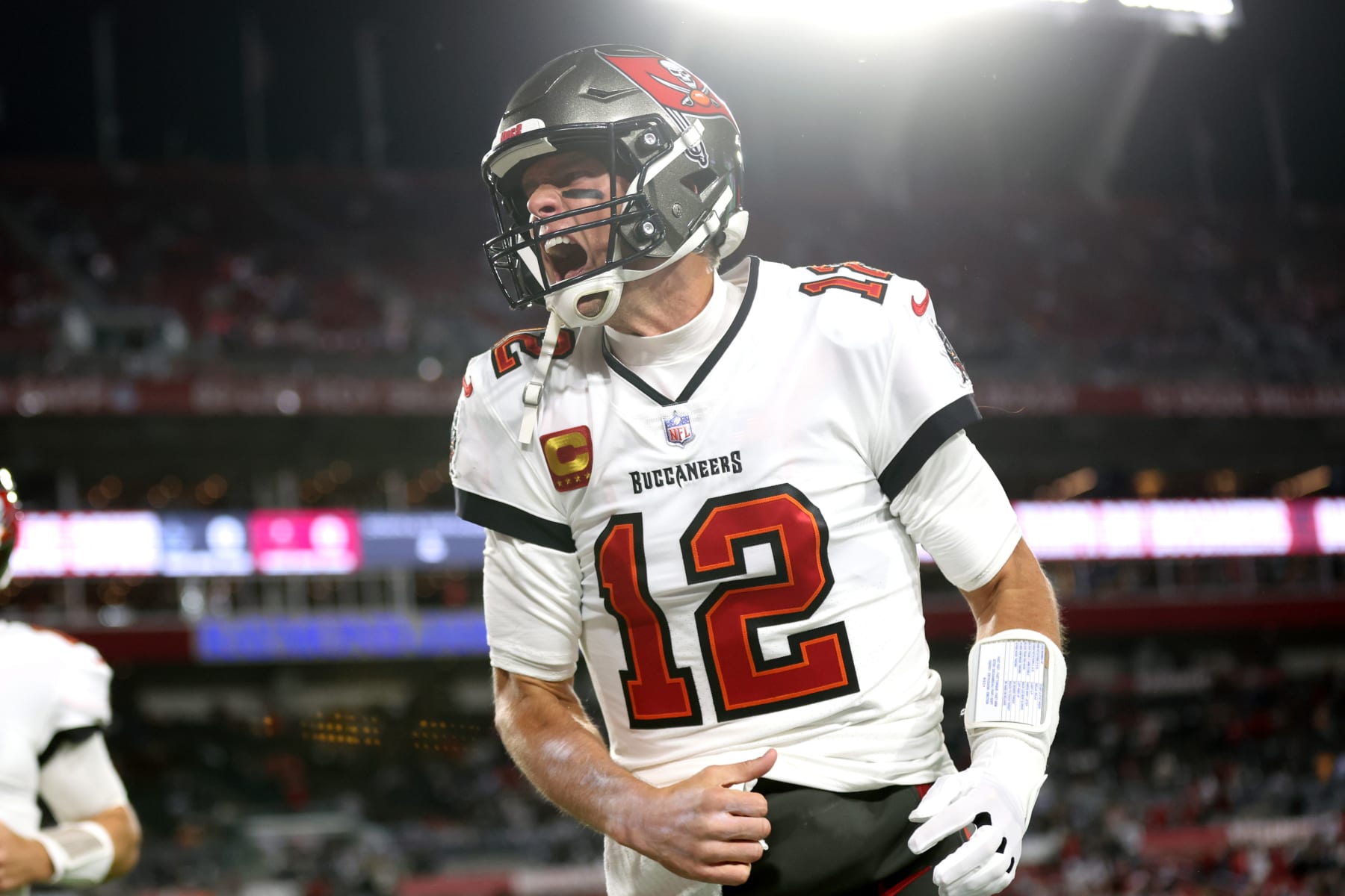 TAMPA, FLORIDA - JANUARY 16: Tom Brady  #12 of the Tampa Bay Buccaneers screams in celebration against the Dallas Cowboys prior to the NFC Wild Card Playoff game at Raymond James Stadium on January 16, 2023 in Tampa, Florida. (Perry Knotts/Getty Images)