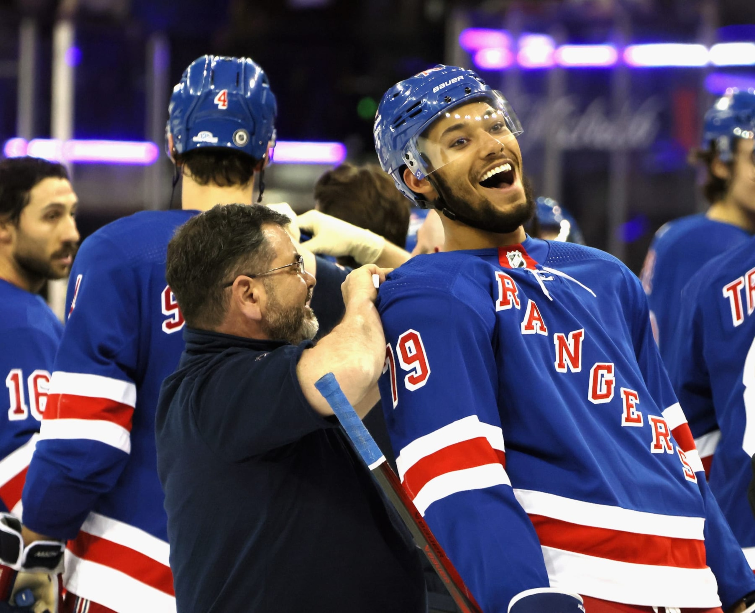 NEW YORK, NEW YORK - APRIL 15: A trainer removes the tracking module from K'Andre Miller #79 of the New York Rangers jersey at Madison Square Garden on April 15, 2024 in New York City.  The Rangers shut out the Senators 4-0. (Photo by Bruce Bennett/Getty Images)
