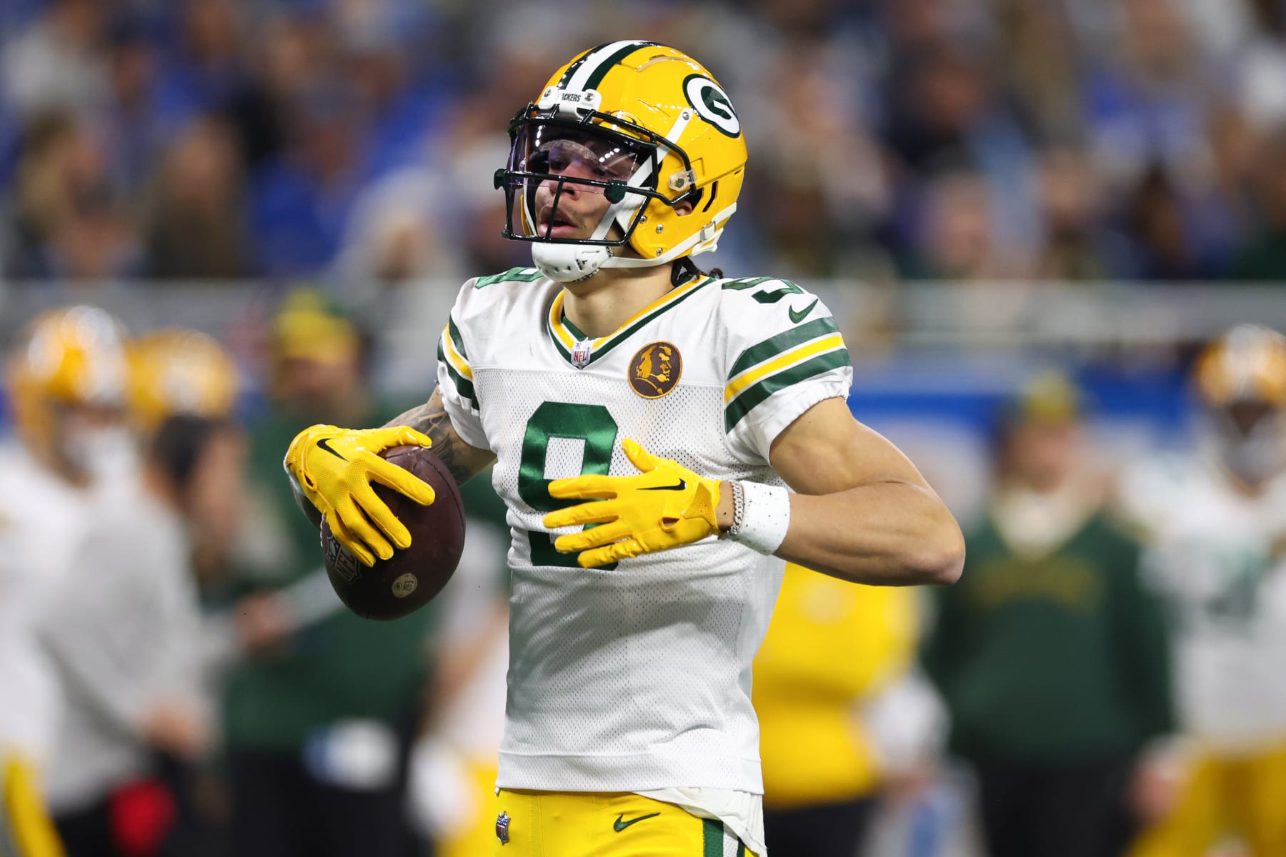 DETROIT, MICHIGAN - NOVEMBER 23: Christian Watson #9 of the Green Bay Packers reacts after catching a pass against the Detroit Lions during the first quarter of the game at Ford Field on November 23, 2023 in Detroit, Michigan. (Photo by Gregory Shamus/Getty Images)