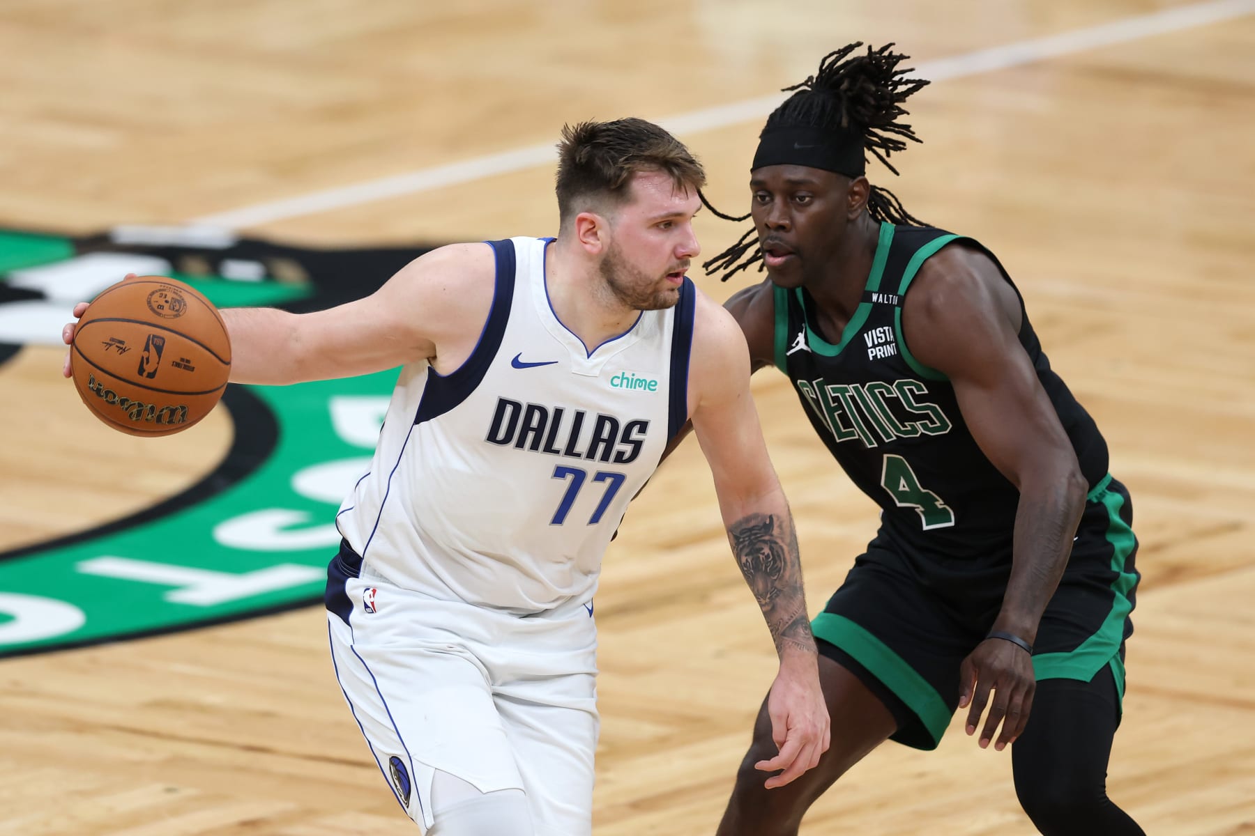 BOSTON, MASSACHUSETTS - JUNE 09: Luka Doncic #77 of the Dallas Mavericks dribbles the ball against Jrue Holiday #4 of the Boston Celtics during the third quarter in Game Two of the 2024 NBA Finals at TD Garden on June 09, 2024 in Boston, Massachusetts. NOTE TO USER: User expressly acknowledges and agrees that, by downloading and or using this photograph, User is consenting to the terms and conditions of the Getty Images License Agreement. (Photo by Adam Glanzman/Getty Images)
