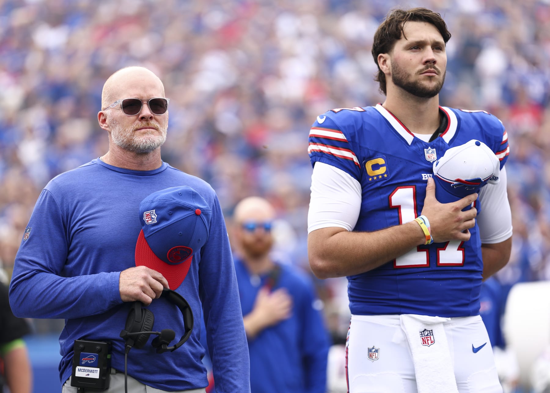 ORCHARD PARK, NY - SEPTEMBER 17: Head coach Sean McDermott and Josh Allen #17 of the Buffalo Bills stand on the sidelines during the national anthem prior to an NFL football game against the Las Vegas Raiders at Highmark Stadium on September 17, 2023 in Orchard Park, New York. (Photo by Kevin Sabitus/Getty Images)