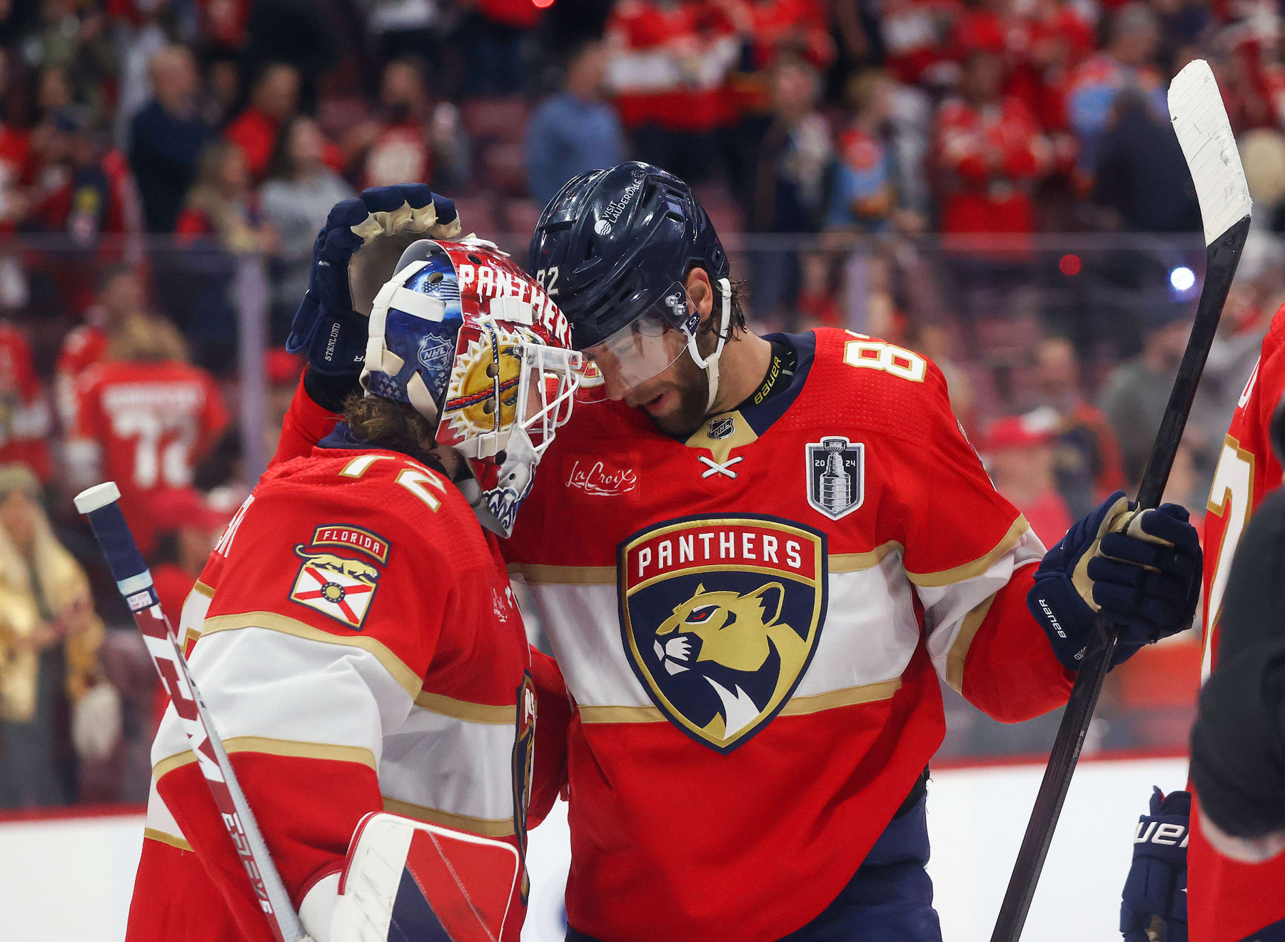 SUNRISE, FL - JUNE 10: Goaltender Sergei Bobrovsky #72 is congratulated by Kevin Stenlund #82 of the Florida Panthers after the 4-1 win against the Edmonton Oilers in Game Two of the Final of the 2024 Stanley Cup Playoffs at the Amerant Bank Arena on June 10, 2024 in Sunrise, Florida. (Photo by Joel Auerbach/Getty Images)