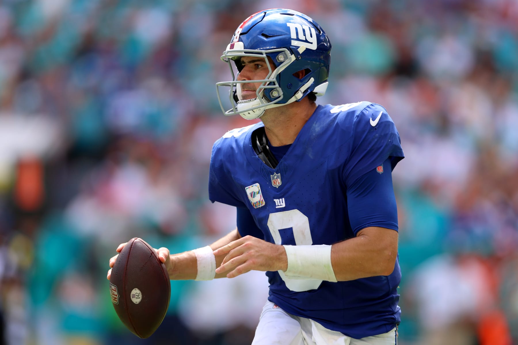 MIAMI GARDENS, FLORIDA - OCTOBER 08: Daniel Jones #8 of the New York Giants looks to pass during the first half against the Miami Dolphins at Hard Rock Stadium on October 08, 2023 in Miami Gardens, Florida. (Photo by Megan Briggs/Getty Images)