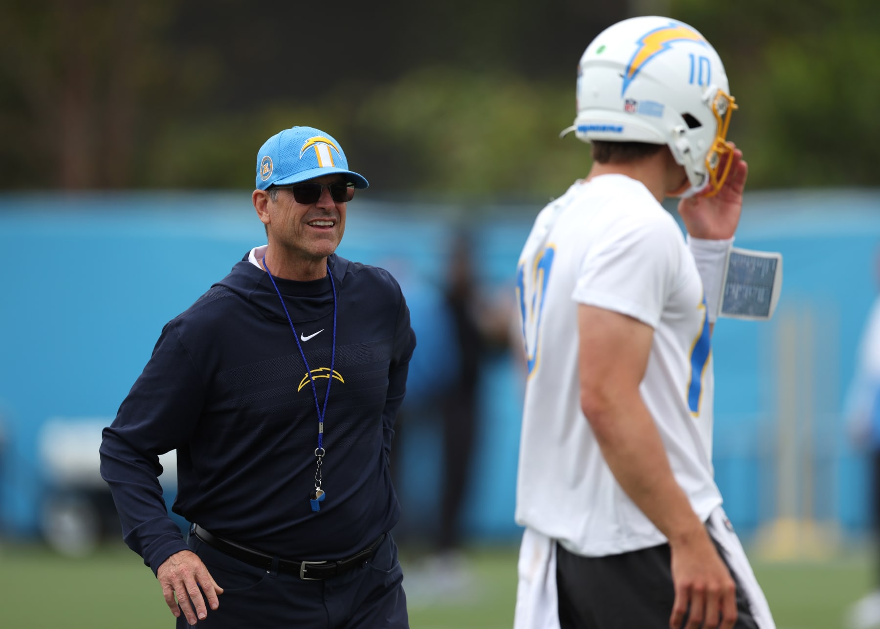 COSTA MESA, CALIFORNIA - MAY 20: Head coach Jim Harbaugh and quarterback Justin Herbert during a Los Angeles Chargers OTA offseason workout on May 20, 2024 in Costa Mesa, California. (Photo by Harry How/Getty Images)