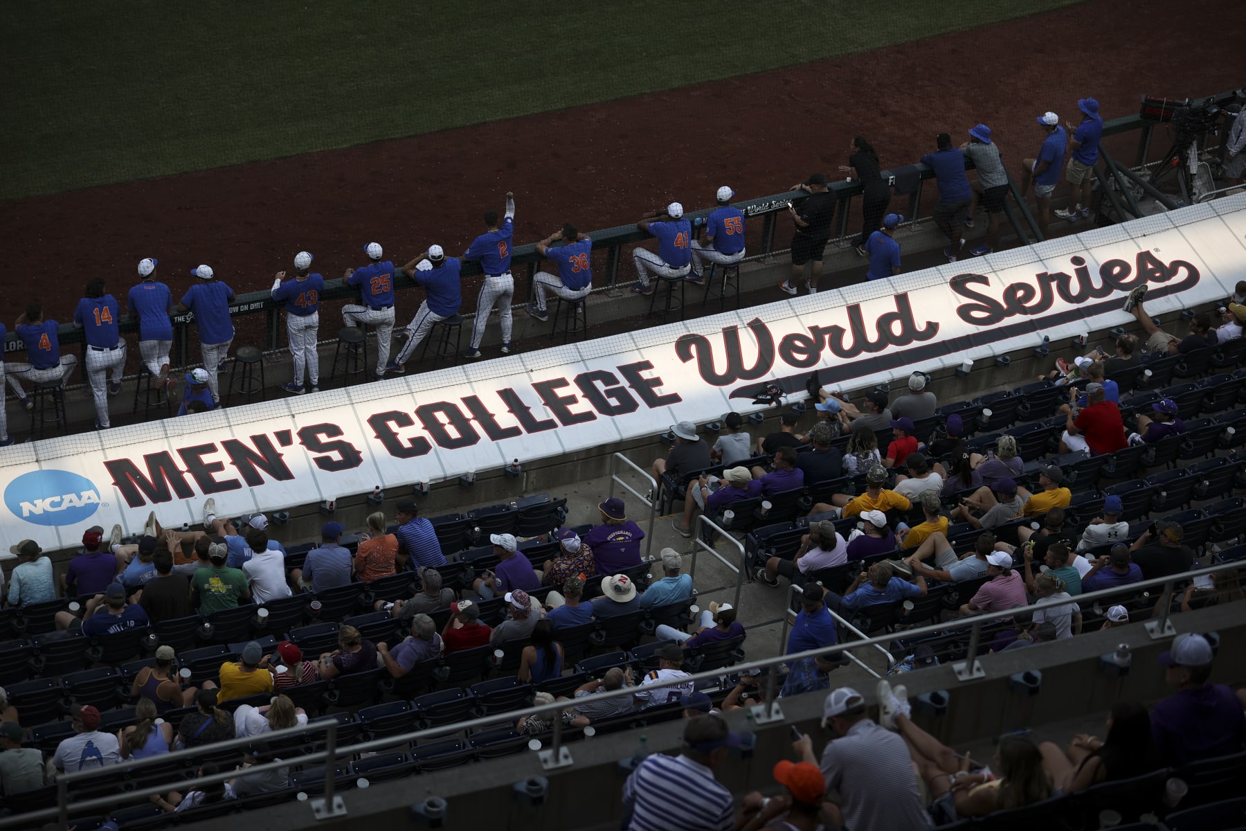 OMAHA, NE - JUNE 25: The Mens College World Series logo is illuminated but the setting sun during Game 2 of the Division I Mens Baseball Championship finals between the LSU Tigers and the Florida Gators held at Charles Schwab Field on June 25, 2023 in Omaha, Nebraska. (Photo by Tyler Schank/NCAA Photos via Getty Images)
