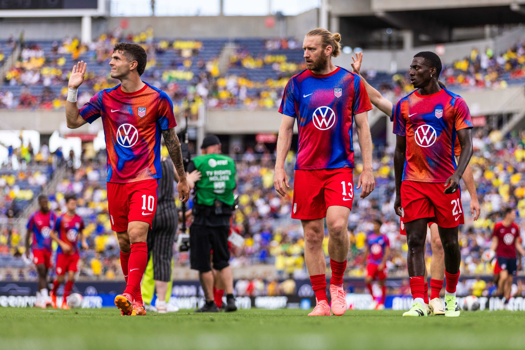 ORLANDO, FLORIDA - JUNE 12: Christian Pulisic #10, Tim Ream #13, and Tim Weah #21 of the United States at Camping World Stadium on June 12, 2024 in Orlando, Florida. (Photo by Mark Thorstenson/ISI Photos/USSF/Getty Images for USSF)