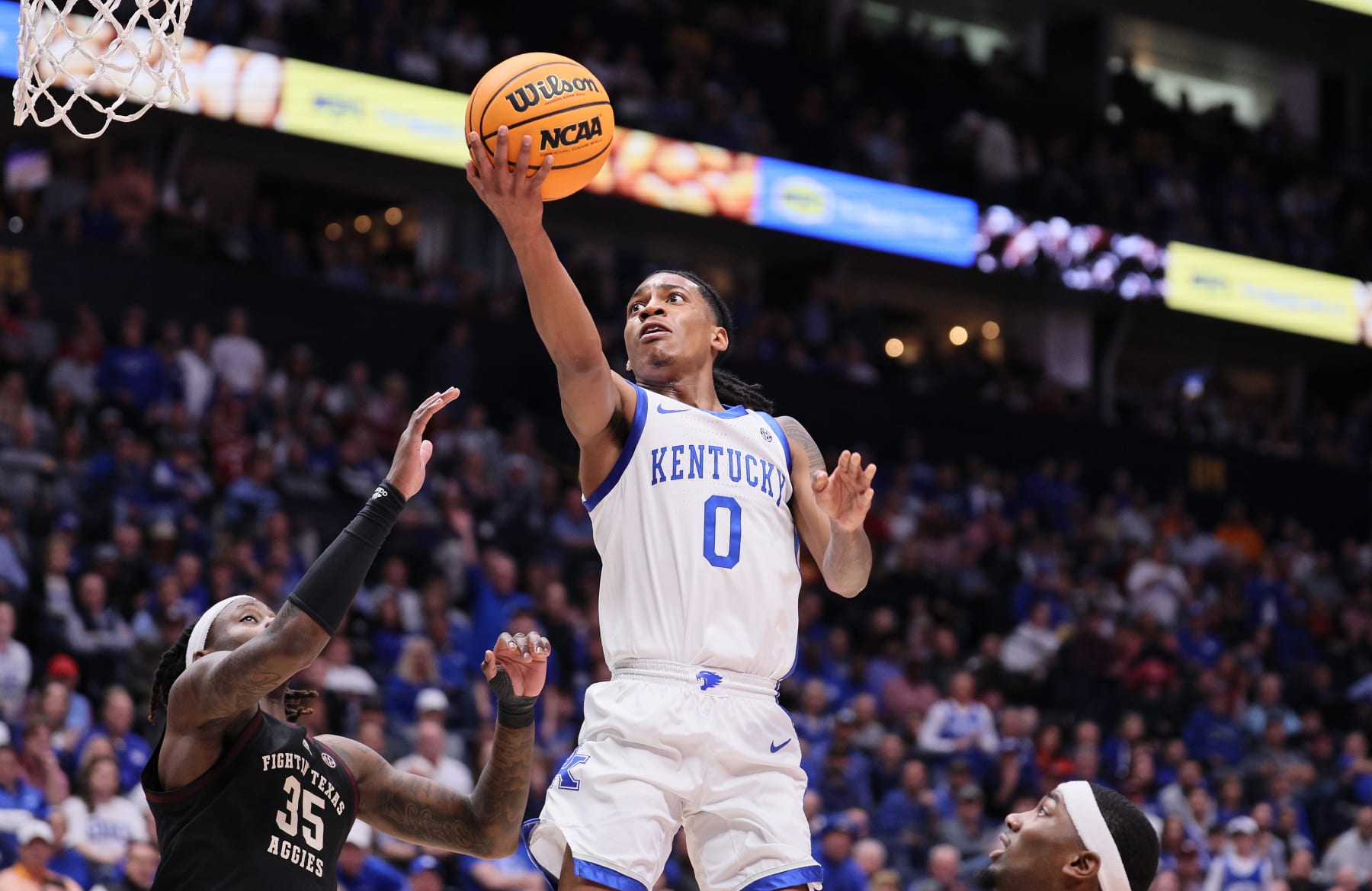 NASHVILLE, TENNESSEE - MARCH 15: Rob Dillingham #0 of the Kentucky Wildcats shoots the ball in the first half against the Texas A&M Aggies during the quarterfinals of the SEC Basketball Tournament at Bridgestone Arena on March 15, 2024 in Nashville, Tennessee. (Photo by Andy Lyons/Getty Images)