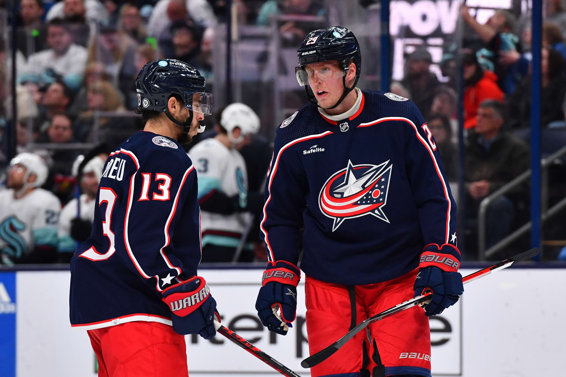 COLUMBUS, OHIO - MARCH 3: Patrik Laine #29 of the Columbus Blue Jackets talks with teammate Johnny Gaudreau #13 of the Columbus Blue Jackets during the first period of a game against the Seattle Kraken at Nationwide Arena on March 3, 2023 in Columbus, Ohio. (Photo by Ben Jackson/NHLI via Getty Images)