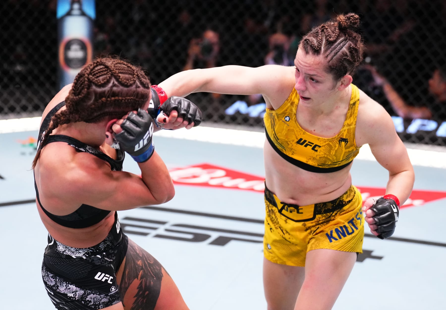 LAS VEGAS, NEVADA - JUNE 15: (R-L) Josefine Knutsson of Sweden punches Julia Polastri of Brazil in a strawweight fight during the UFC Fight Night event at UFC APEX on June 15, 2024 in Las Vegas, Nevada. (Photo by Chris Unger/Zuffa LLC via Getty Images)
