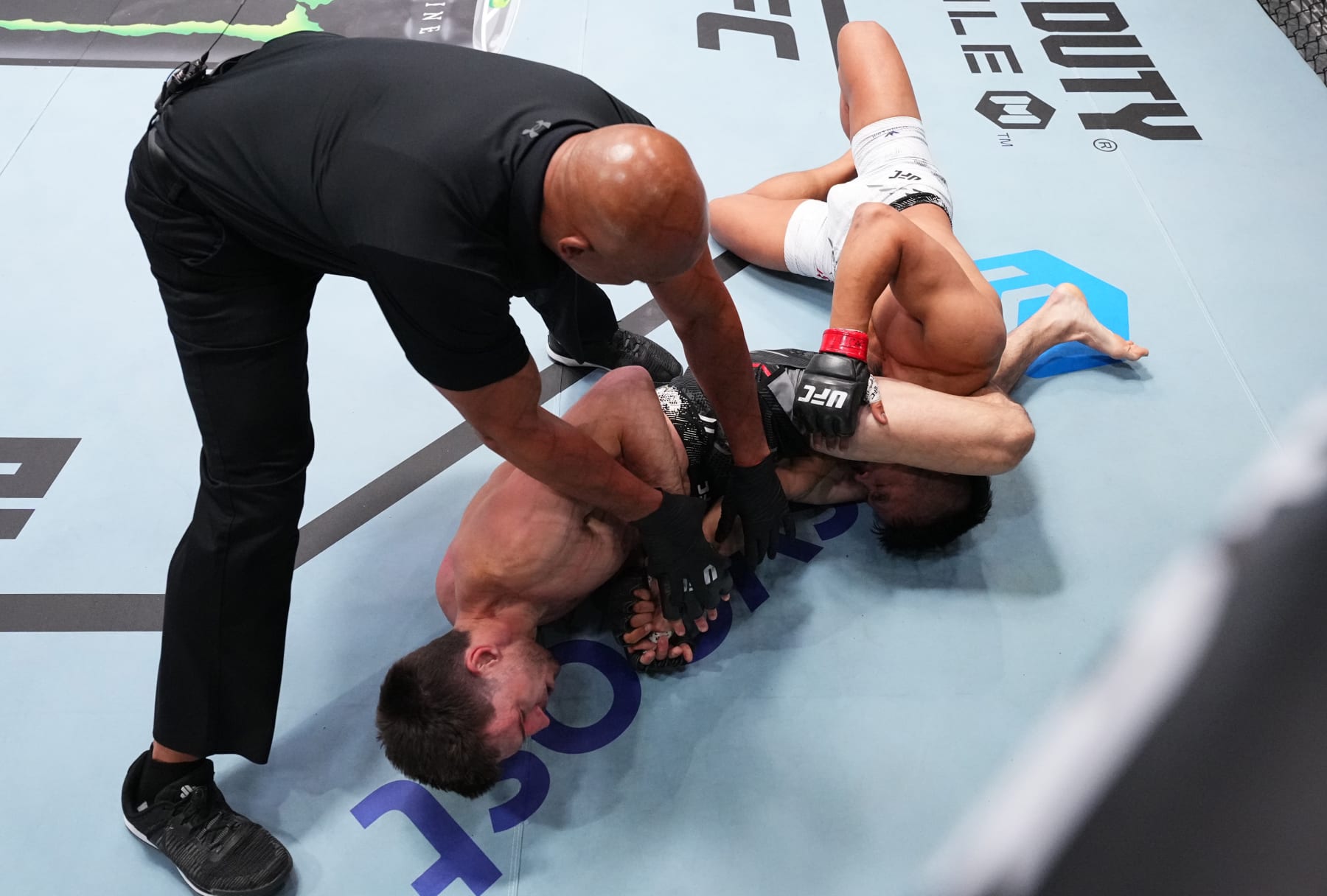 LAS VEGAS, NEVADA - JUNE 15: (L-R) Westin Wilson secures an arm bar submission against Jeka Saragih of Indonesia in a featherweight fight during the UFC Fight Night event at UFC APEX on June 15, 2024 in Las Vegas, Nevada. (Photo by Chris Unger/Zuffa LLC via Getty Images)