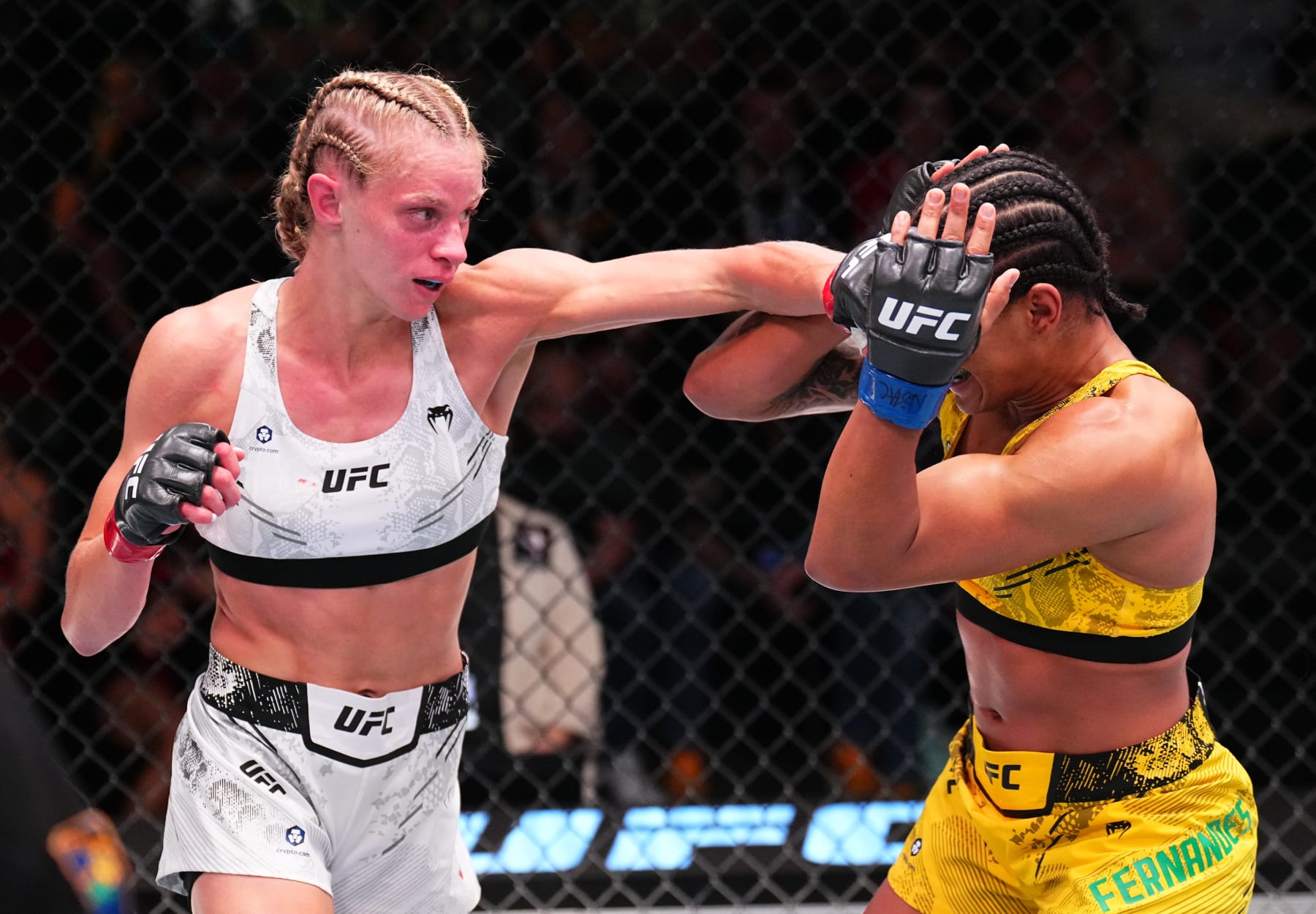 LAS VEGAS, NEVADA - JUNE 15: Carli Judice punches Gabriella Fernandes of Brazil in a flyweight fight during the UFC Fight Night event at UFC APEX on June 15, 2024 in Las Vegas, Nevada. (Photo by Chris Unger/Zuffa LLC via Getty Images)