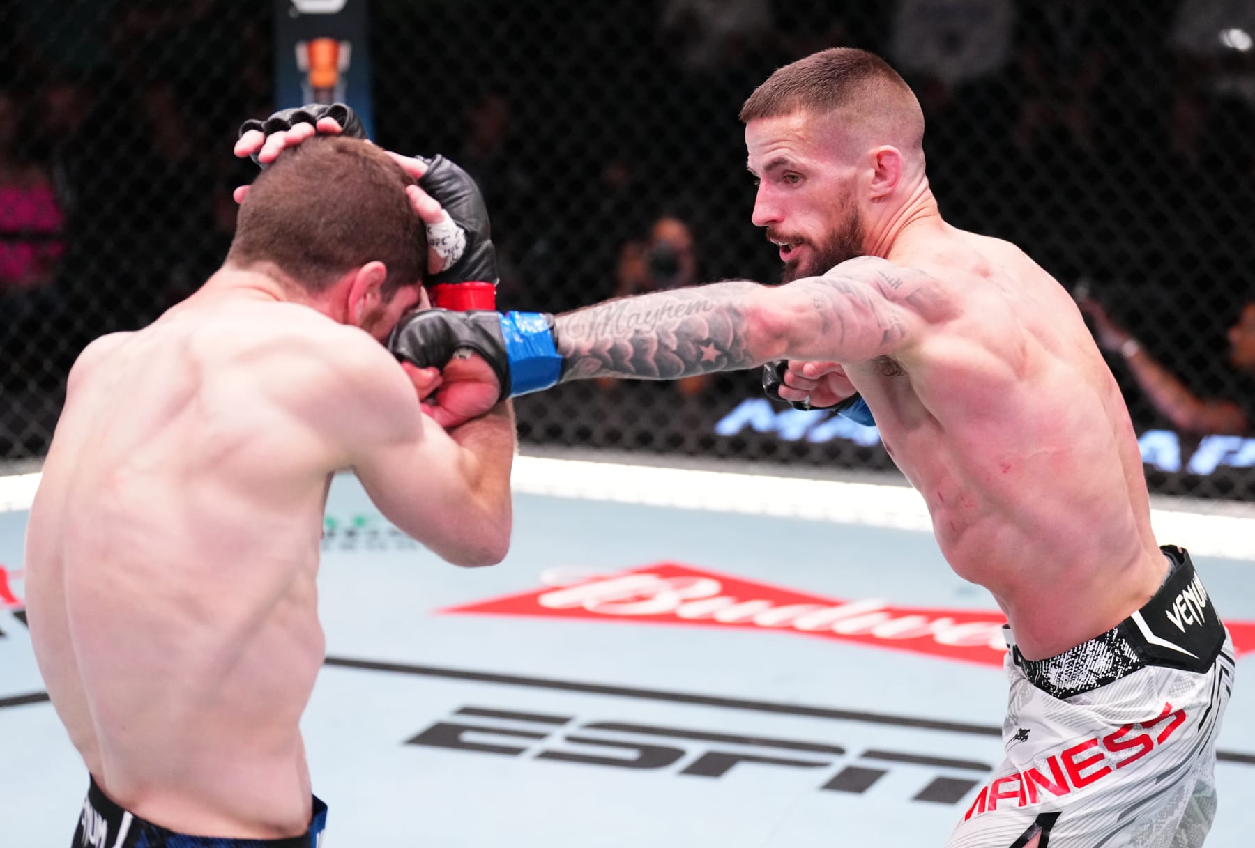 LAS VEGAS, NEVADA - JUNE 15: (R-L) Nate Maness punches Jimmy Flick in a flyweight fight during the UFC Fight Night event at UFC APEX on June 15, 2024 in Las Vegas, Nevada. (Photo by Chris Unger/Zuffa LLC via Getty Images)
