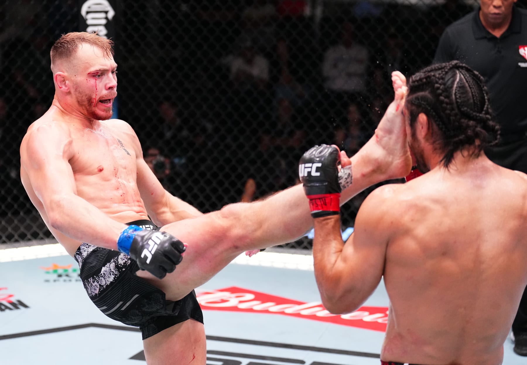 LAS VEGAS, NEVADA - JUNE 15: (L-R) Adam Fugitt kicks Josh Quinlan in a welterweight fight during the UFC Fight Night event at UFC APEX on June 15, 2024 in Las Vegas, Nevada. (Photo by Chris Unger/Zuffa LLC via Getty Images)