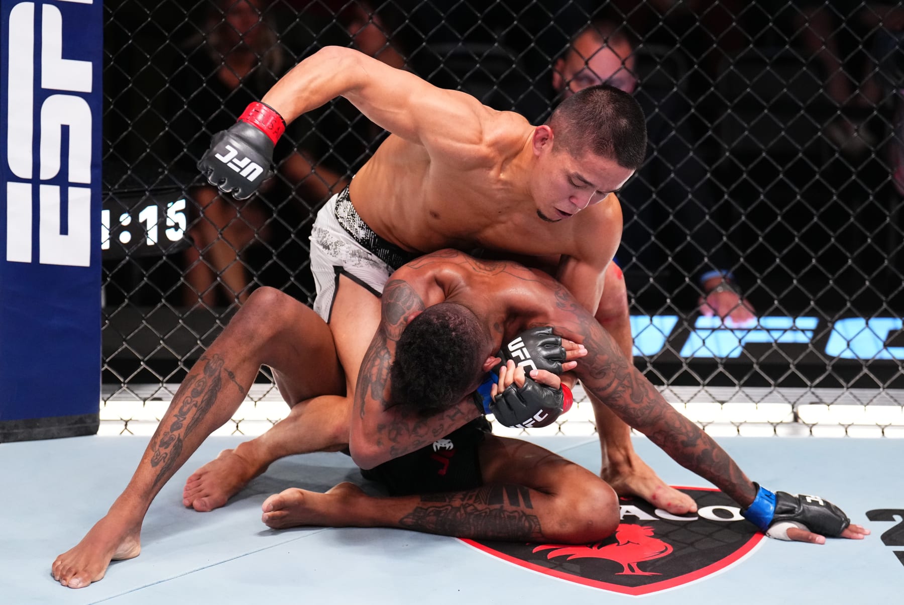 LAS VEGAS, NEVADA - JUNE 15: (L-R) Asu Almabayev of Kazakstan battles Jose Johnson in a flyweight fight during the UFC Fight Night event at UFC APEX on June 15, 2024 in Las Vegas, Nevada. (Photo by Chris Unger/Zuffa LLC via Getty Images)