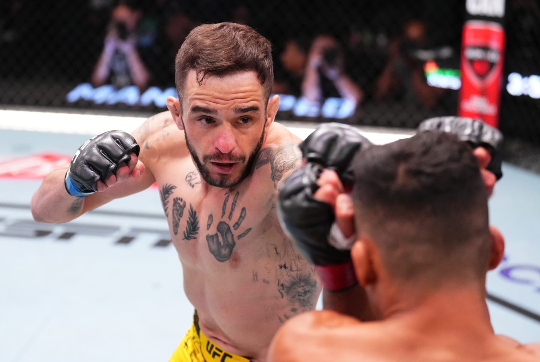 LAS VEGAS, NEVADA - JUNE 15: (L-R) Lucas Almeida of Brazil punches Timmy Cuamba in a featherweight fight during the UFC Fight Night event at UFC APEX on June 15, 2024 in Las Vegas, Nevada. (Photo by Chris Unger/Zuffa LLC via Getty Images)