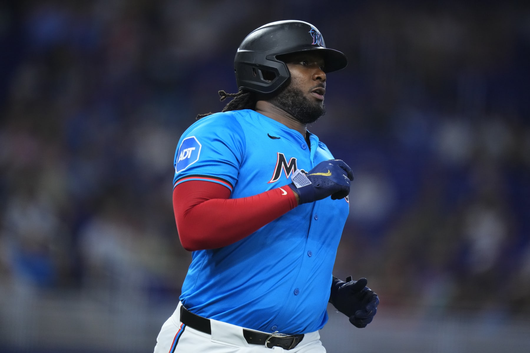 MIAMI, FLORIDA - JUNE 09: Josh Bell #9 of the Miami Marlins. runs into first base during a game against the Cleveland Guardians  at loanDepot park on June 09, 2024 in Miami, Florida. (Photo by Rich Storry/Getty Images)