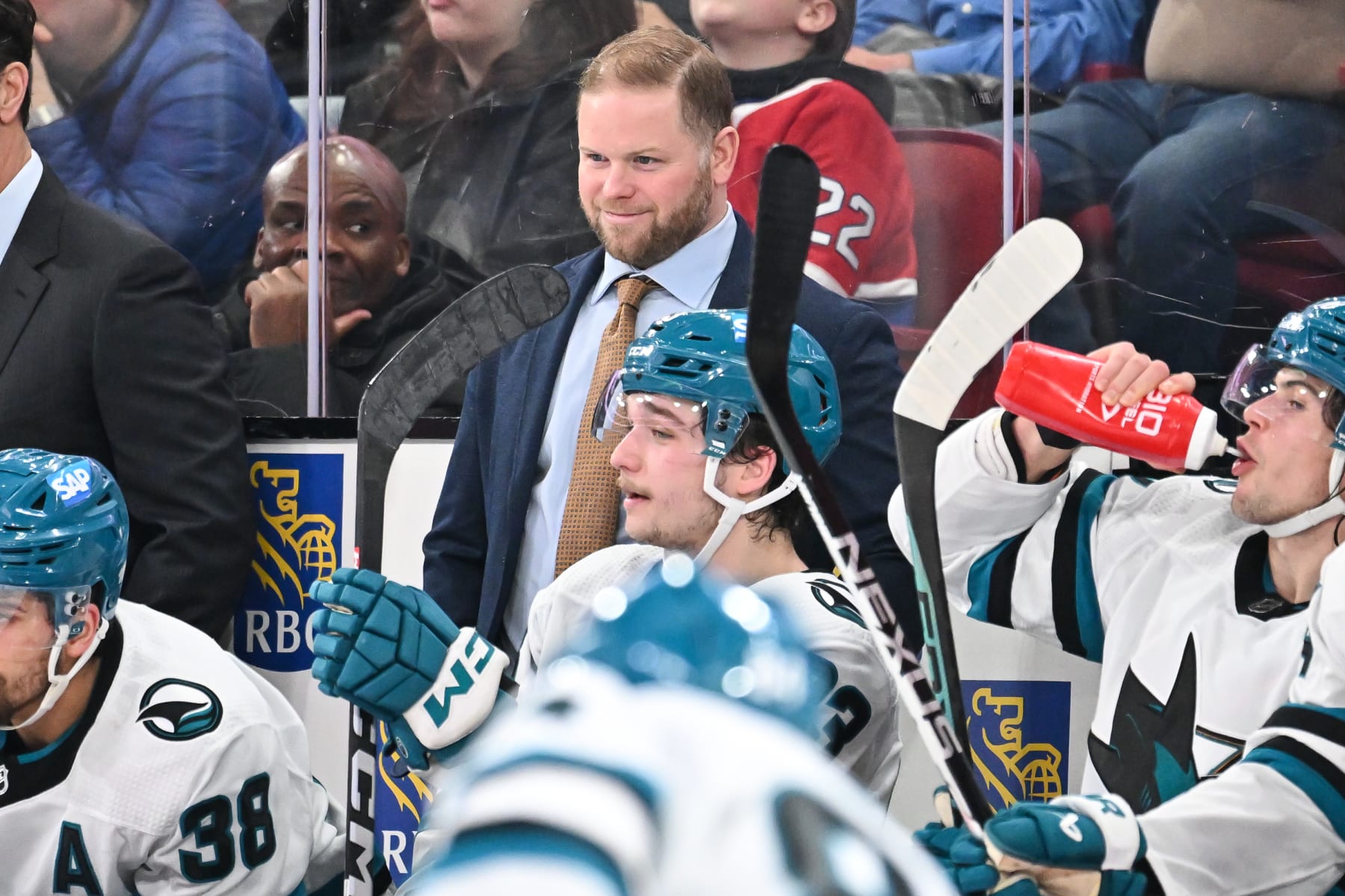 MONTREAL, CANADA - JANUARY 11: Assistant coach of the San Jose Sharks Ryan Warsofsky, handles bench duties during the second period against the Montreal Canadiens at the Bell Centre on January 11, 2024 in Montreal, Quebec, Canada. The San Jose Sharks defeated the Montreal Canadiens 3-2. (Photo by Minas Panagiotakis/Getty Images)