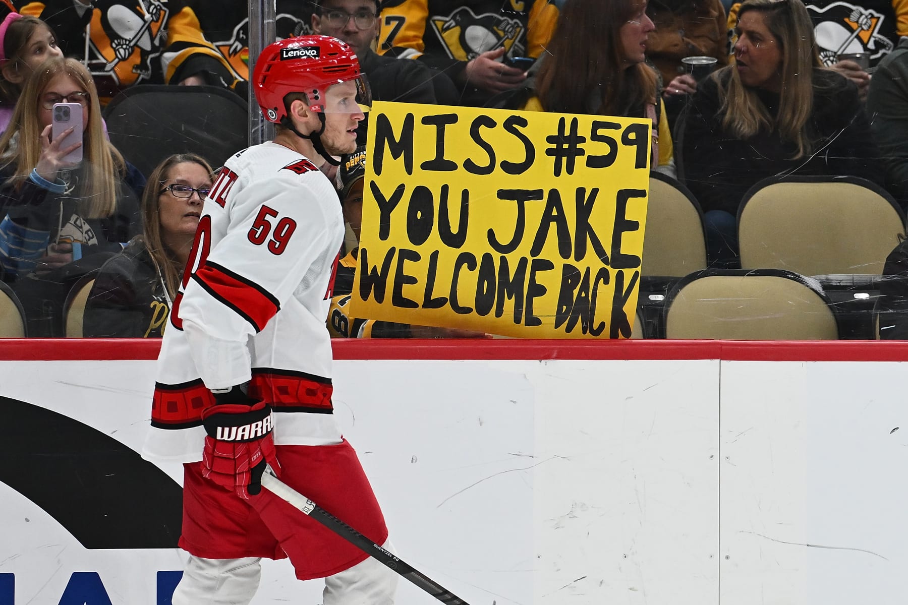 PITTSBURGH, PENNSYLVANIA - MARCH 26: A fan holds up a sign about Jake Guentzel #59 of the Carolina Hurricanes in the second period during the game between the Pittsburgh Penguins and the Carolina Hurricanes at PPG PAINTS Arena on March 26, 2024 in Pittsburgh, Pennsylvania. (Photo by Justin Berl/Getty Images)