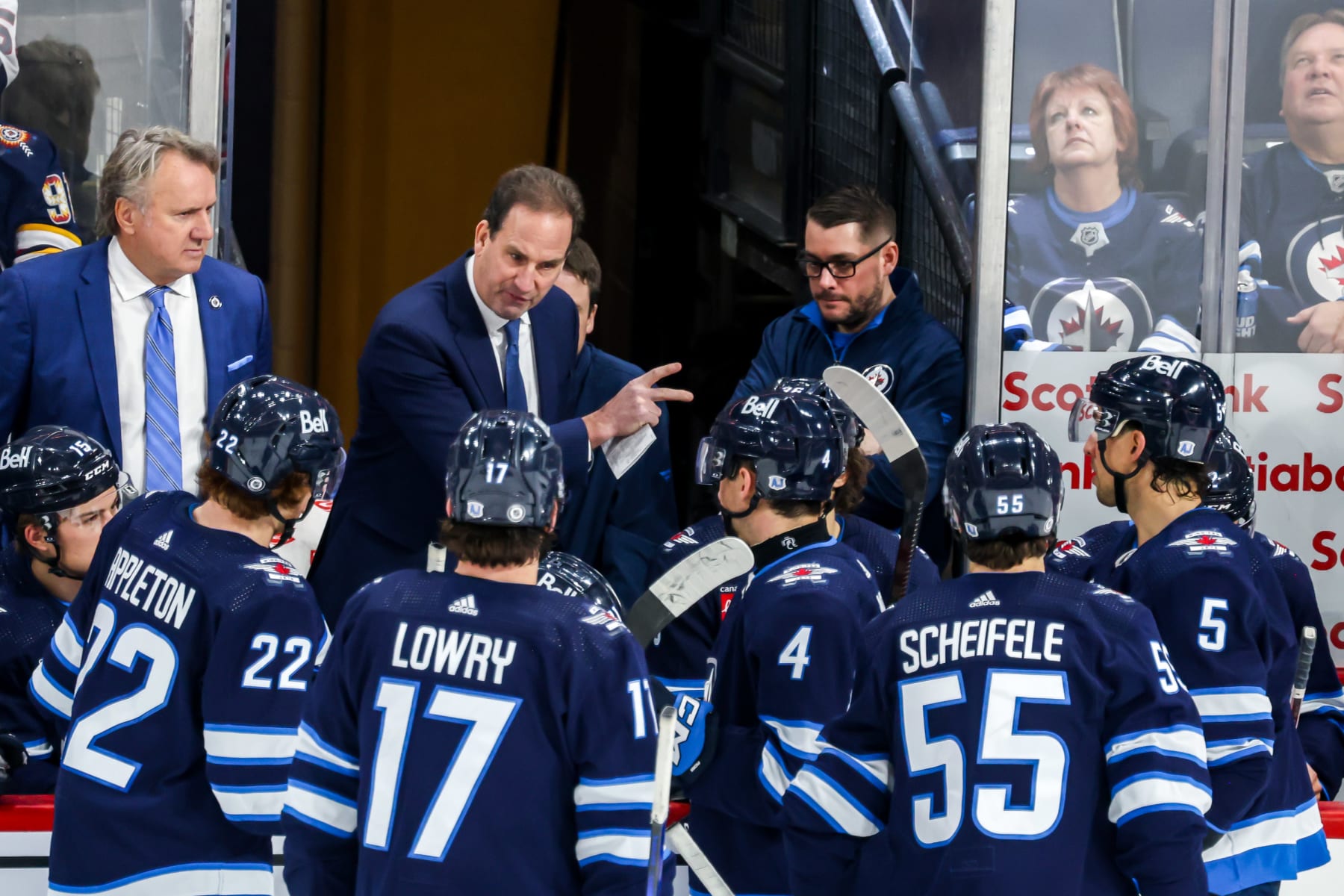 WINNIPEG, CANADA - FEBRUARY 25: Associate Coach Scott Arniel of the Winnipeg Jets instructs players at the bench during a stoppage in third period action against the Arizona Coyotes at the Canada Life Centre on February 25, 2024 in Winnipeg, Manitoba, Canada. (Photo by Jonathan Kozub/NHLI via Getty Images)