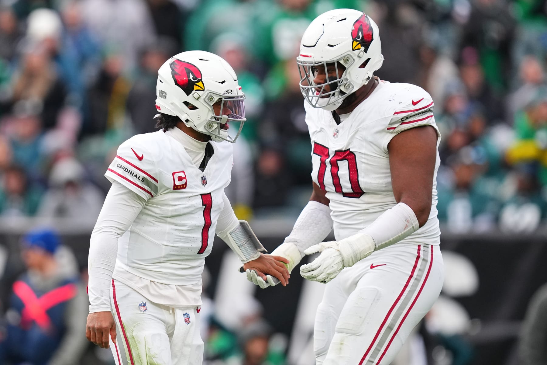 PHILADELPHIA, PENNSYLVANIA - DECEMBER 31: Kyler Murray #1 celebrates a touchdown pass with Paris Johnson Jr. #70 of the Arizona Cardinals during the third quarter against the Philadelphia Eagles at Lincoln Financial Field on December 31, 2023 in Philadelphia, Pennsylvania. (Photo by Mitchell Leff/Getty Images)