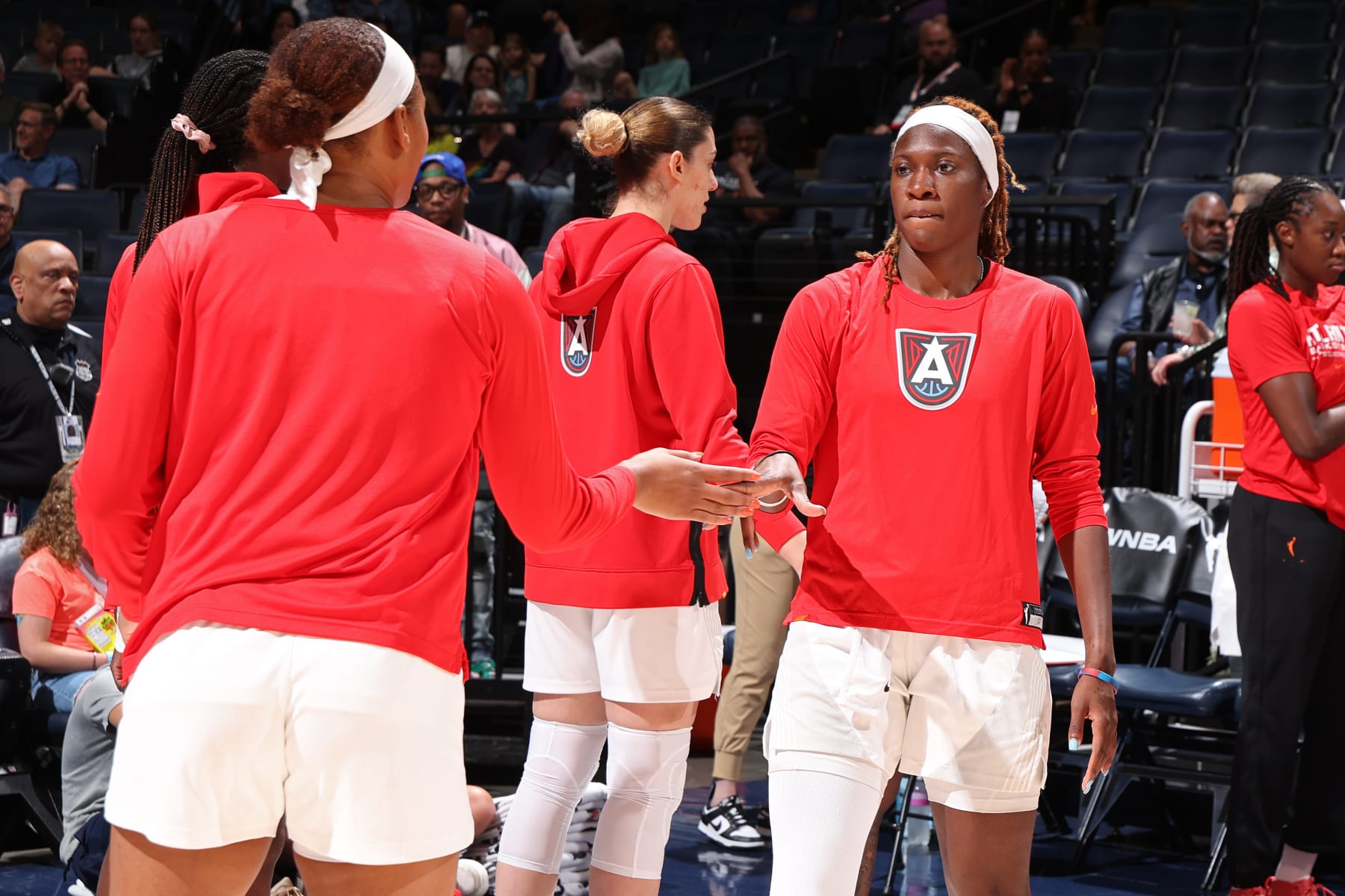MINNEAPOLIS, MN -  JUNE 19: Rhyne Howard #10 of the Atlanta Dream high fives Naz Hillmon #00 before the game against the Minnesota Lynx on June 19, 2024 at Target Center in Minneapolis, Minnesota. NOTE TO USER: User expressly acknowledges and agrees that, by downloading and or using this Photograph, user is consenting to the terms and conditions of the Getty Images License Agreement. Mandatory Copyright Notice: Copyright 2024 NBAE (Photo by David Sherman/NBAE via Getty Images)
