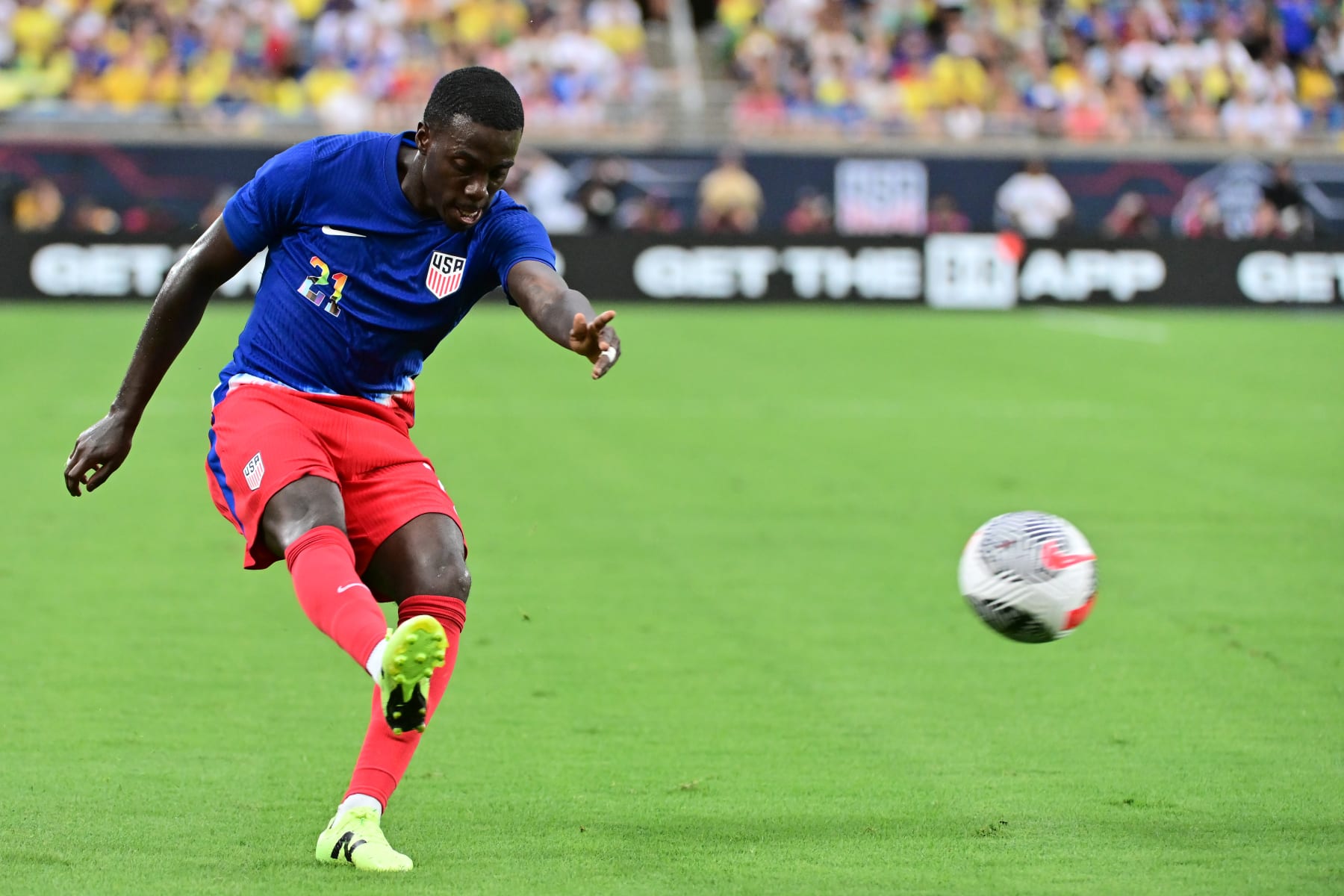 ORLANDO, FLORIDA - JUNE 12: Tim Weah #21 of the United States strikes the ball during the first half against Brazil at Camping World Stadium on June 12, 2024 in Orlando, Florida. (Photo by Julio Aguilar/USSF/Getty Images for USSF)