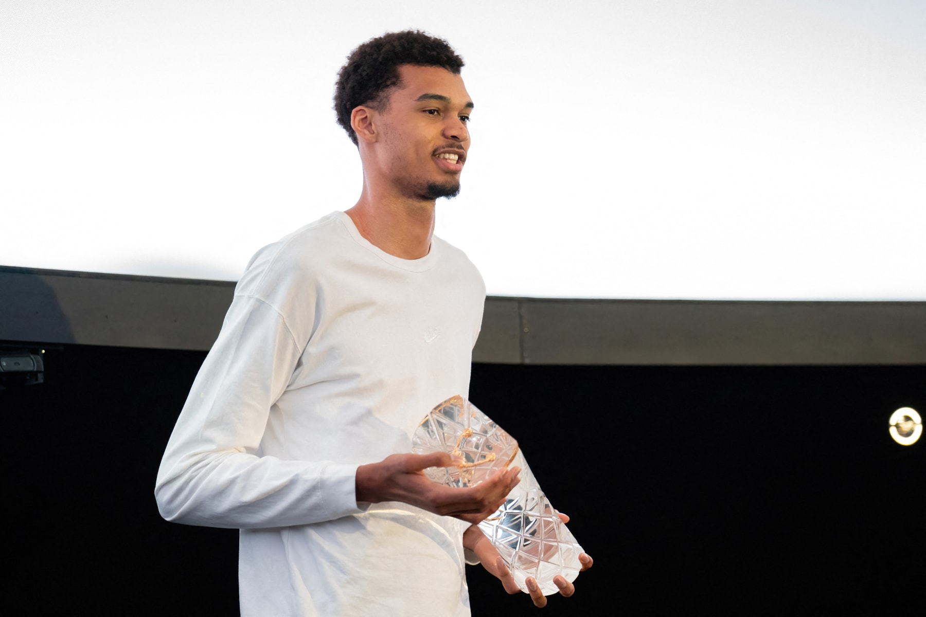San Antonio Spurs French player Victor Wembanyama receives his 2023-24 Rookie of the Year trophy at the Scobee Education Center and Planetarium on May 11, 2024 in San Antonio, Texas. (Photo by SUZANNE CORDEIRO / AFP) (Photo by SUZANNE CORDEIRO/AFP via Getty Images)