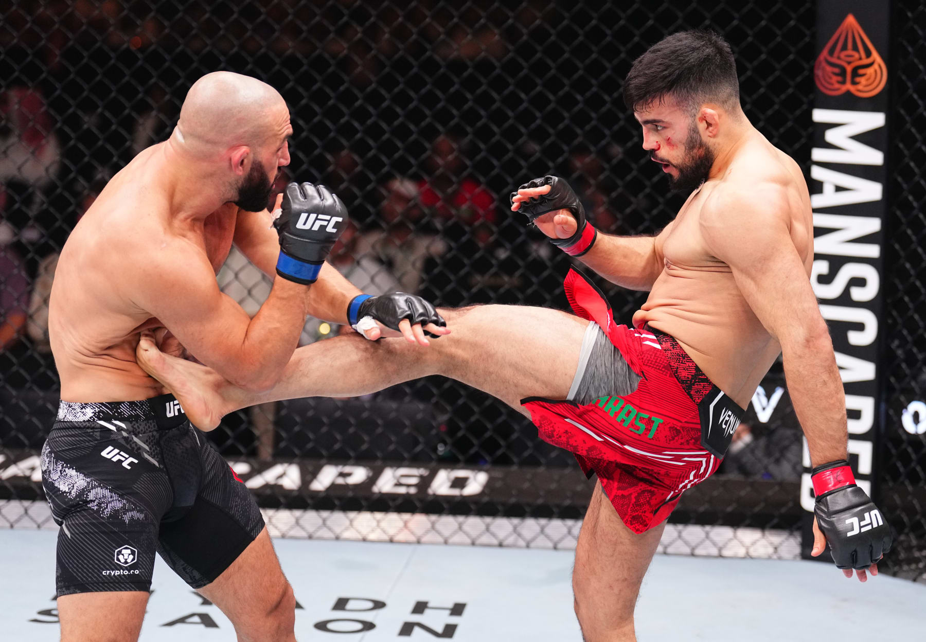 RIYADH, SAUDI ARABIA - JUNE 22: (R-L) Nasrat Haqparast of Germany kicks Jared Gordon in a lightweight fight during the UFC Fight Night event at Kingdom Arena on June 22, 2024 in Riyadh, Saudi Arabia. (Photo by Chris Unger/Zuffa LLC via Getty Images)