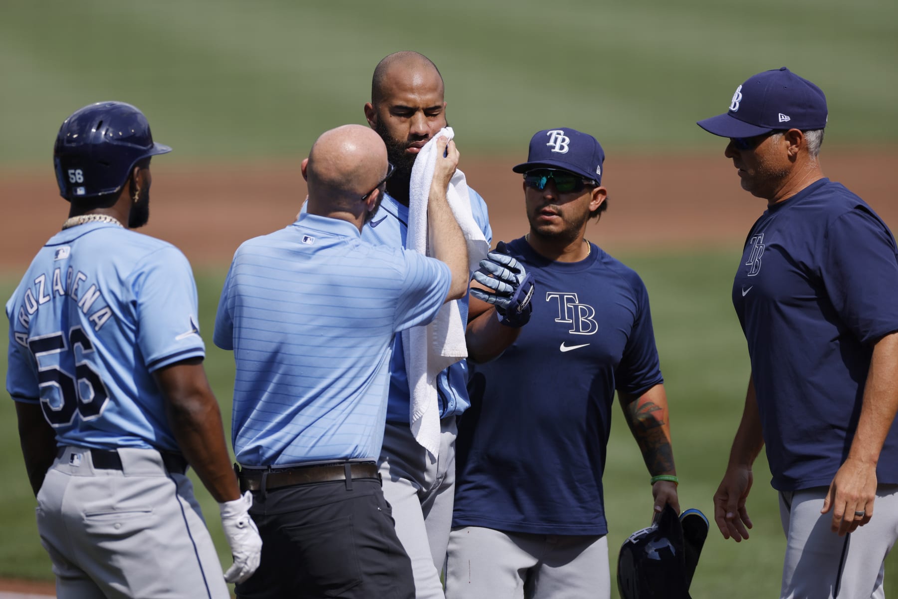 PITTSBURGH, PA - JUNE 22: Tampa Bay Rays outfielder Amed Rosario (10) is tended to after being hit in the face by a pitch during an MLB game against the Pittsburgh Pirates on June 22, 2024 at PNC Park in Pittsburgh, Pennsylvania. (Photo by Joe Robbins/Icon Sportswire via Getty Images)