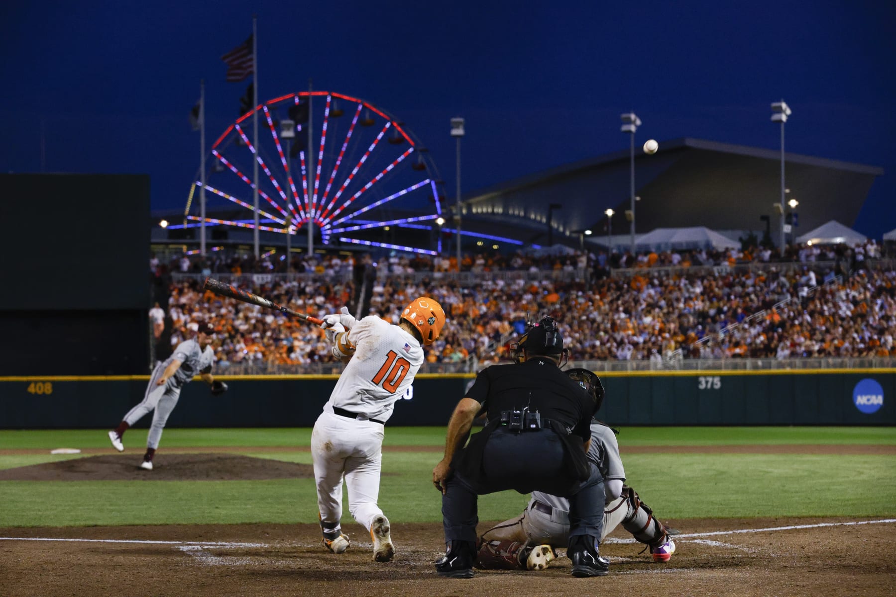 OMAHA, NEBRASKA - JUNE 22: Cal Stark #10 of the Tennessee Volunteers hits against the Texas A&M Aggies during the Division I Men's Baseball Championship held at Charles Schwab Field on June 22, 2024 in Omaha, Nebraska. (Photo by C. Morgan Engel/NCAA Photos via Getty Images)