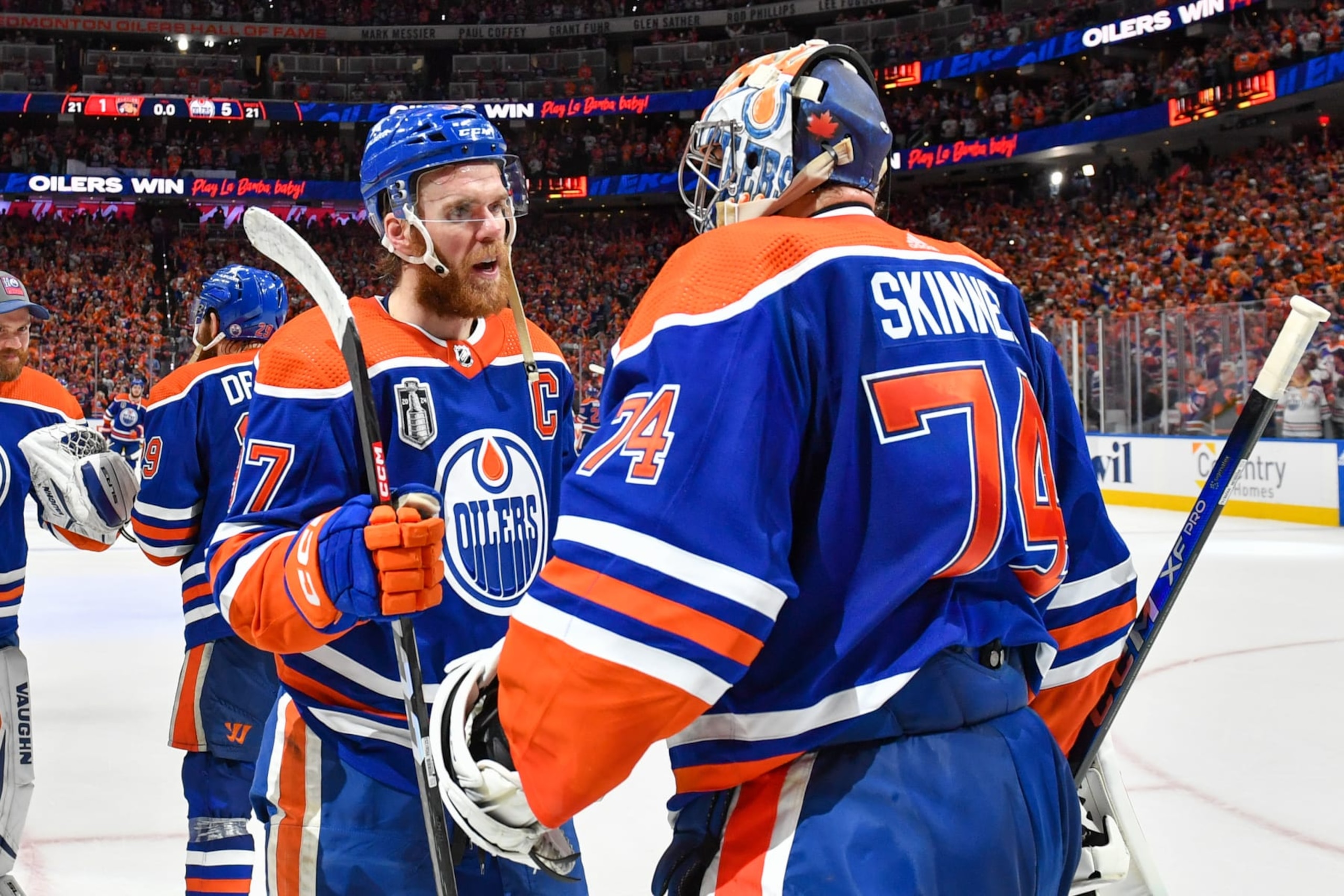EDMONTON, CANADA - JUNE 21: Goaltender Stuart Skinner #74 and Connor McDavid #97 of the Edmonton Oilers celebrate their win against the Florida Panthers in Game Six of the 2024 Stanley Cup Final at Rogers Place on June 21, 2024, in Edmonton, Alberta, Canada. (Photo by Andy Devlin/NHLI via Getty Images)