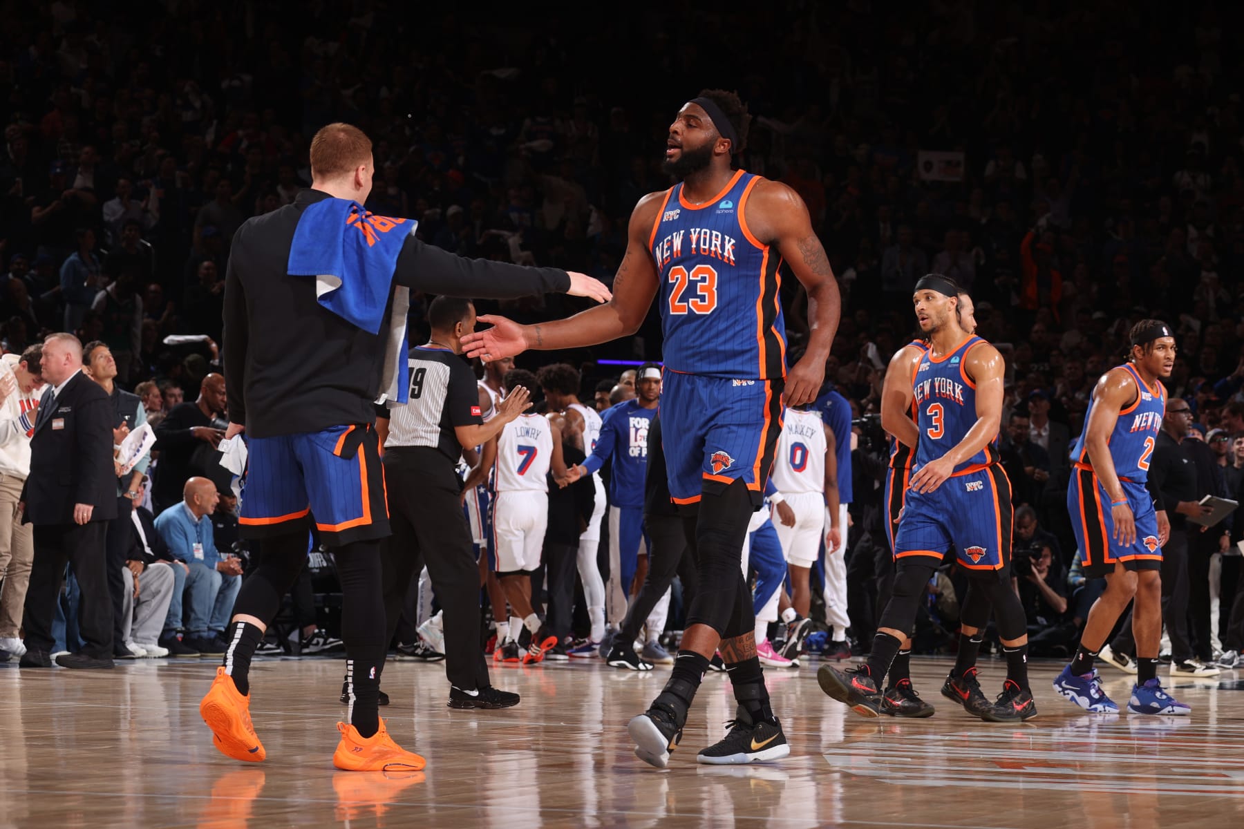 NEW YORK, NY - APRIL 30: Mitchell Robinson #23 high fives Donte Divincenzo #0 of the New York Knicks during the game against the Philadelphia 76ers during Round 1 Game 5 of the 2024 NBA Playoffs on April 30, 2024 at Madison Square Garden in New York City, New York.  NOTE TO USER: User expressly acknowledges and agrees that, by downloading and or using this photograph, User is consenting to the terms and conditions of the Getty Images License Agreement. Mandatory Copyright Notice: Copyright 2024 NBAE  (Photo by Nathaniel S. Butler/NBAE via Getty Images)