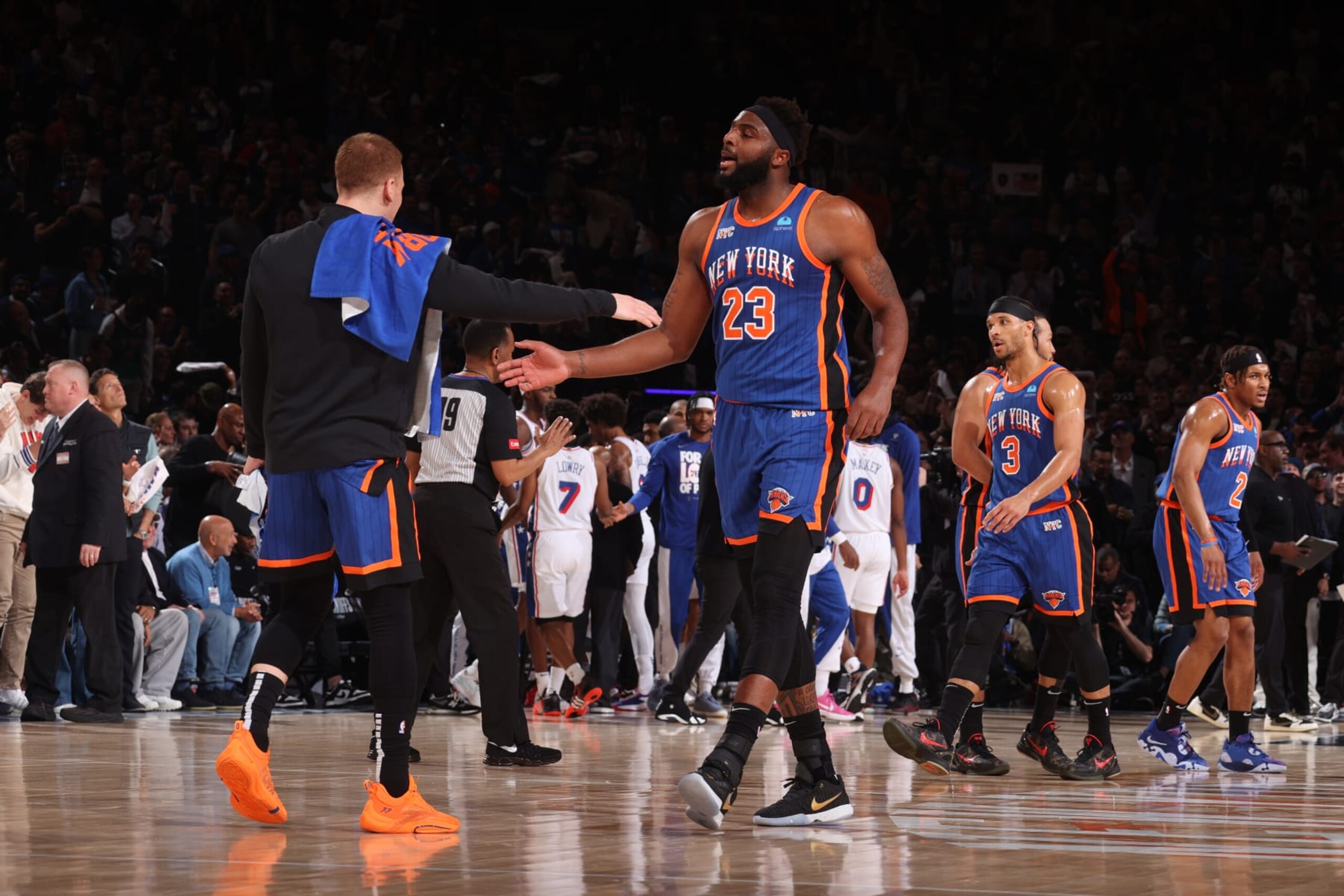 NEW YORK, NY - APRIL 30: Mitchell Robinson #23 high fives Donte Divincenzo #0 of the New York Knicks during the game against the Philadelphia 76ers during Round 1 Game 5 of the 2024 NBA Playoffs on April 30, 2024 at Madison Square Garden in New York City, New York.  NOTE TO USER: User expressly acknowledges and agrees that, by downloading and or using this photograph, User is consenting to the terms and conditions of the Getty Images License Agreement. Mandatory Copyright Notice: Copyright 2024 NBAE  (Photo by Nathaniel S. Butler/NBAE via Getty Images)