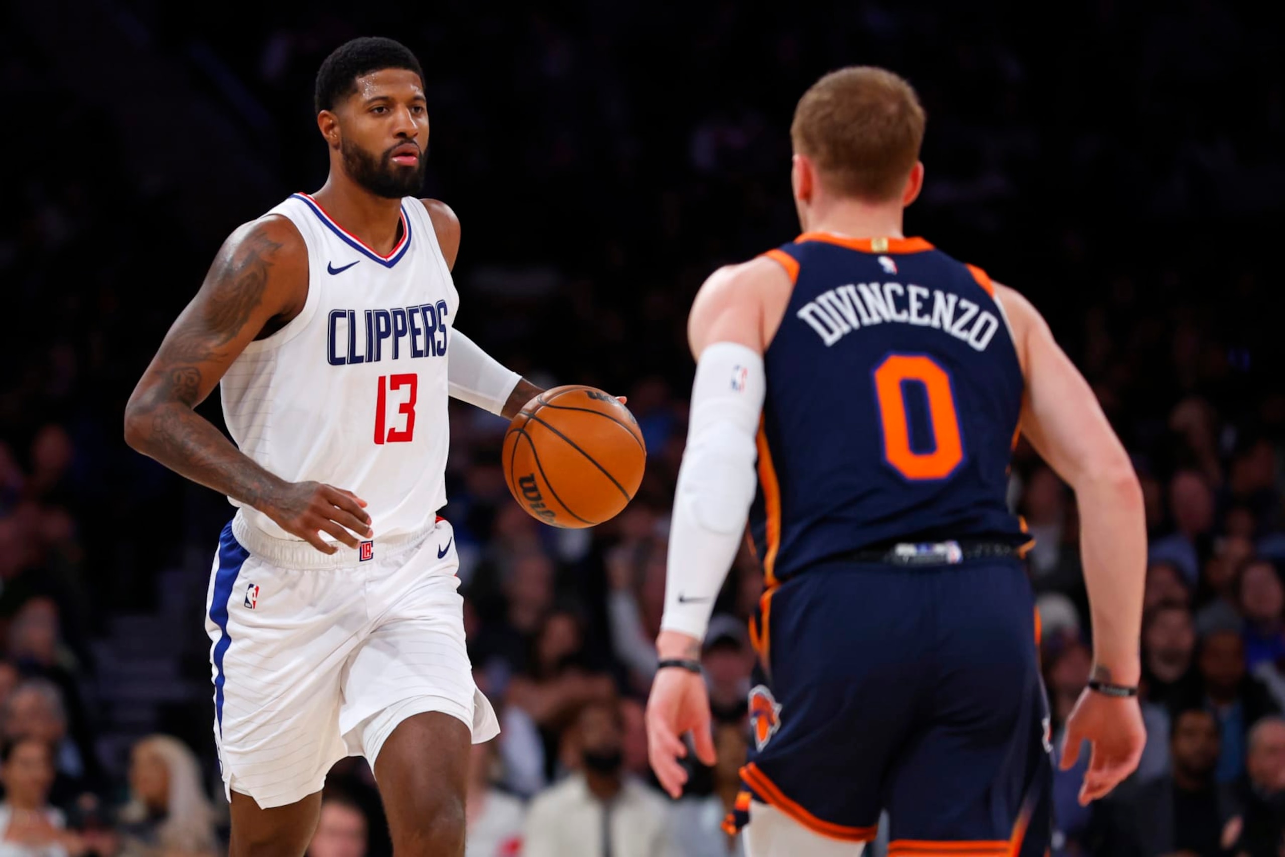 NEW YORK, NEW YORK - NOVEMBER 6: Paul George #13 of the LA Clippers in action against Donte DiVincenzo #0 of the New York Knicks during a game at Madison Square Garden on November 6, 2023 in New York City. The Knicks defeated the Clippers 111-97. NOTE TO USER: User expressly acknowledges and agrees that, by downloading and or using this photograph, User is consenting to the terms and conditions of the Getty Images License Agreement. (Photo by Rich Schultz/Getty Images) NEW YORK, NEW YORK - NOVEMBER 6: Paul George #13 of the LA Clippers in action against Donte DiVincenzo #0 of the New York Knicks during a game at Madison Square Garden on November 6, 2023 in New York City. The Knicks defeated the Clippers 111-97. NOTE TO USER: User expressly acknowledges and agrees that, by downloading and or using this photograph, User is consenting to the terms and conditions of the Getty Images License Agreement. (Photo by Rich Schultz/Getty Images)