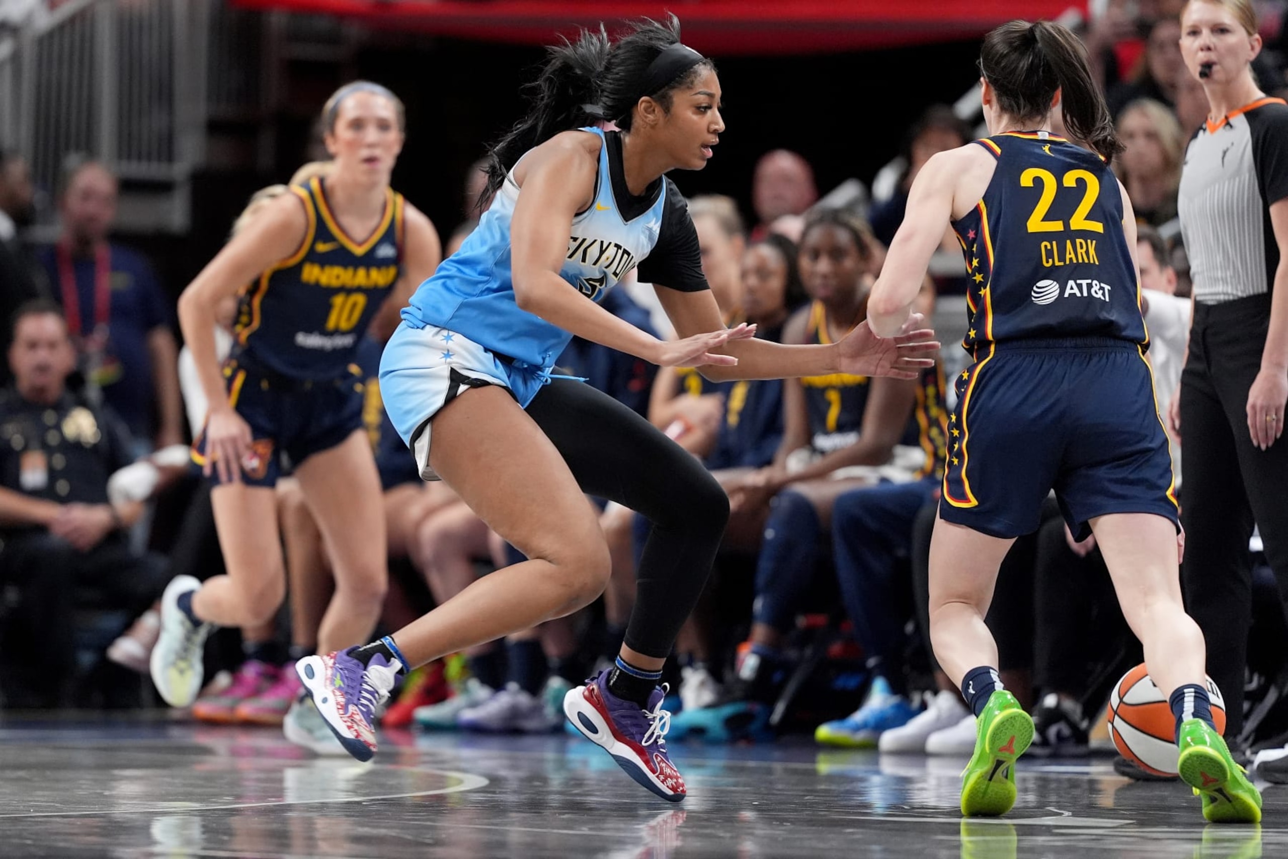 INDIANAPOLIS, INDIANA - JUNE 16: Angel Reese #5 of the Chicago Sky defends Caitlin Clark #22 of the Indiana Fever during the second half at Gainbridge Fieldhouse on June 16, 2024 in Indianapolis, Indiana. NOTE TO USER: User expressly acknowledges and agrees that, by downloading and or using this photograph, User is consenting to the terms and conditions of the Getty Images License Agreement. (Photo by Emilee Chinn/Getty Images)