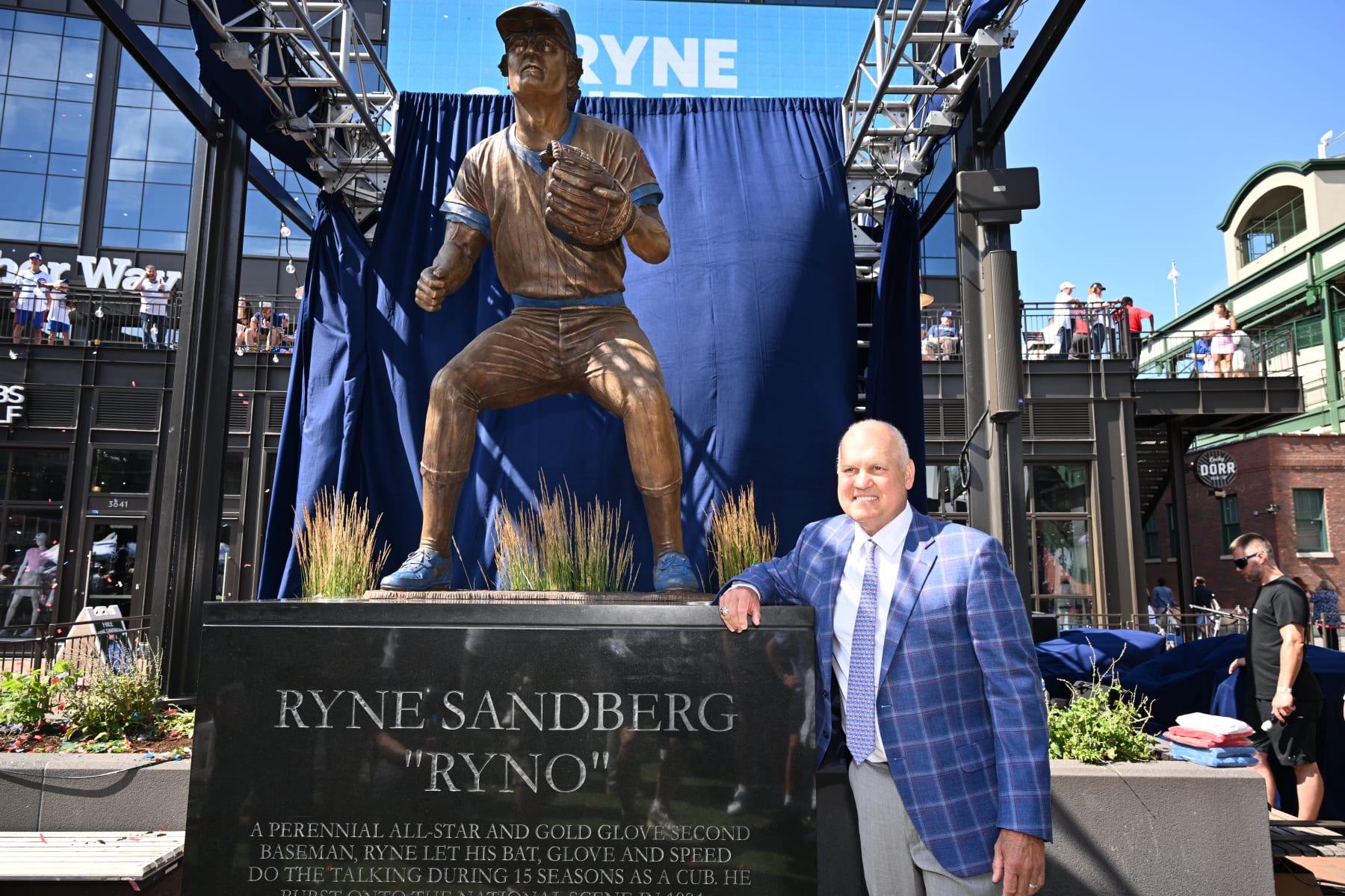 CHICAGO, IL - JUNE 23:  Former Chicago Cubs player and Hall of Famer Ryne Sandberg poses for pictures in front of his statue before a game against the New York Mets at Wrigley Field on June 23, 2024 in Chicago, Illinois.  (Photo by Jamie Sabau/Getty Images)