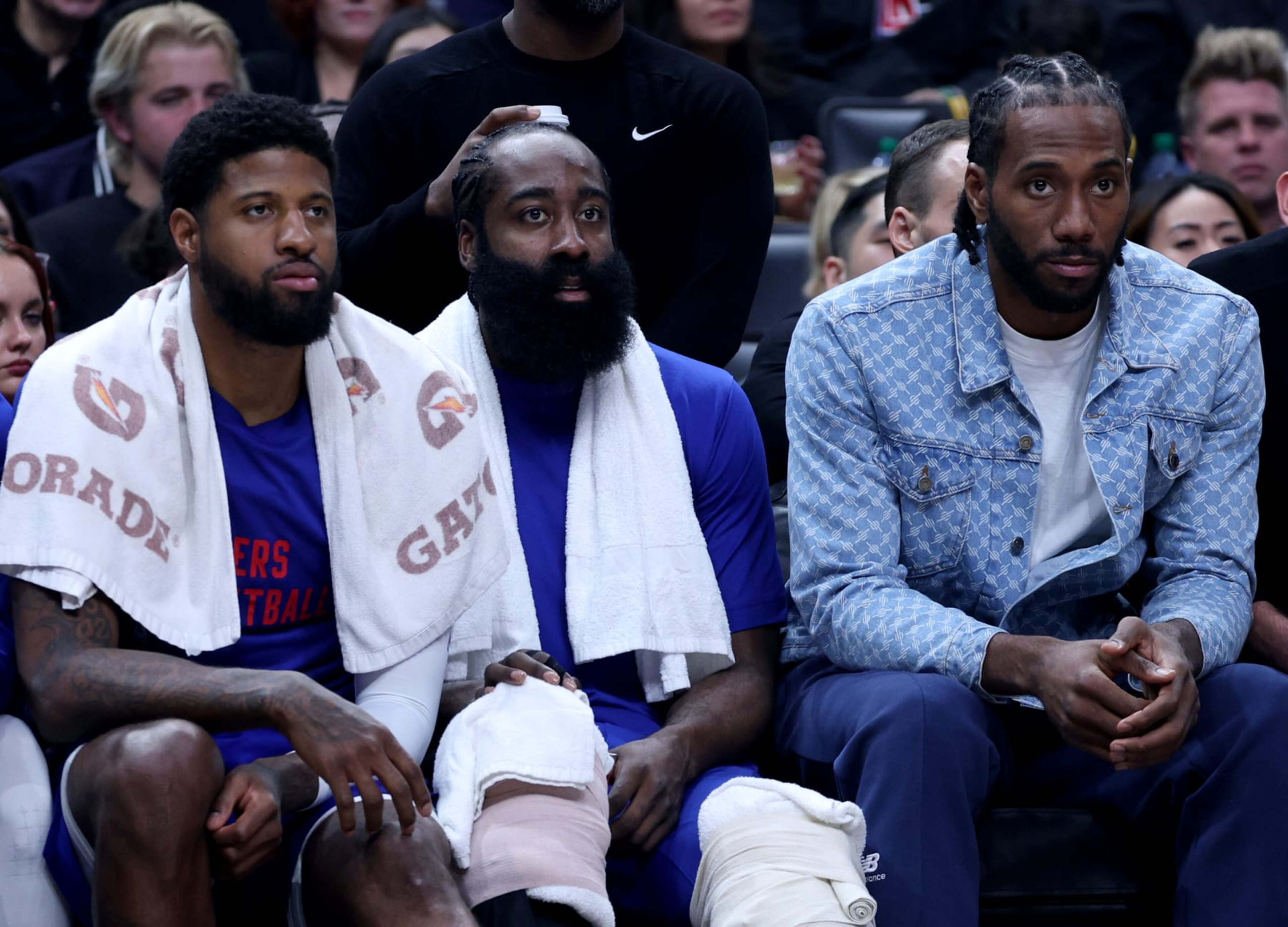 LOS ANGELES, CALIFORNIA - APRIL 12: (L-R) Paul George #13, James Harden #1 and Kawhi Leonard #2 of the LA Clippers watch play from the bench during a 110-109 loss to the Utah Jazz at Crypto.com Arena on April 12, 2024 in Los Angeles, California. User is consenting to the terms and conditions of the Getty Images License Agreement. (Photo by Harry How/Getty Images) LOS ANGELES, CALIFORNIA - APRIL 12: (L-R) Paul George #13, James Harden #1 and Kawhi Leonard #2 of the LA Clippers watch play from the bench during a 110-109 loss to the Utah Jazz at Crypto.com Arena on April 12, 2024 in Los Angeles, California. User is consenting to the terms and conditions of the Getty Images License Agreement. (Photo by Harry How/Getty Images)