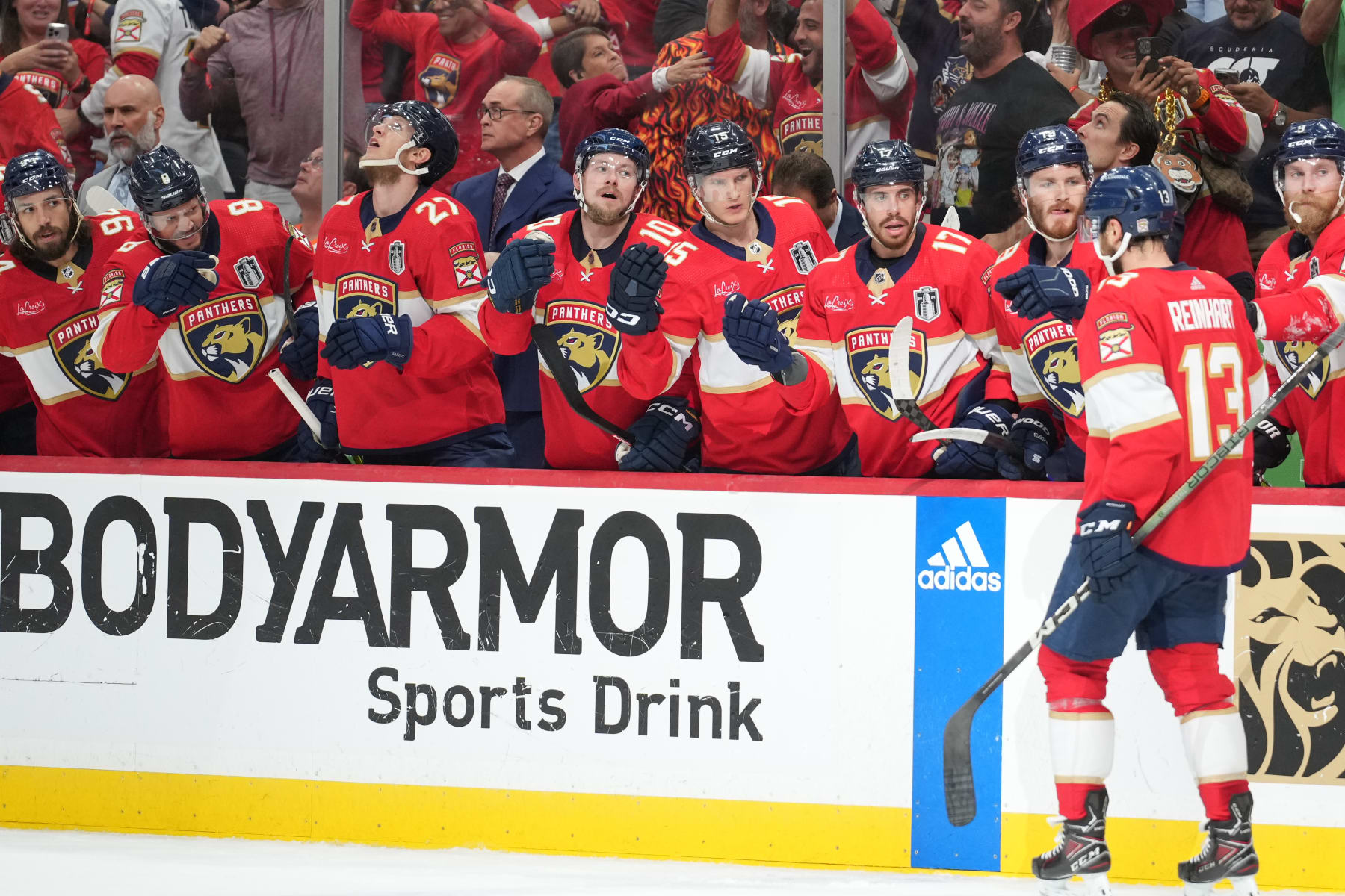 SUNRISE, FL - JUNE 24: Florida Panthers center Sam Reinhart (13) gets fist bumps from the team bench after his goal in the second period during game seven of the Stanley Cup Finals between the Edmonton Oilers and the Florida Panthers on Monday, June 24, 2024  at Amerant Bank Arena in Sunrise, Fla. (Photo by Peter Joneleit/Icon Sportswire via Getty Images)